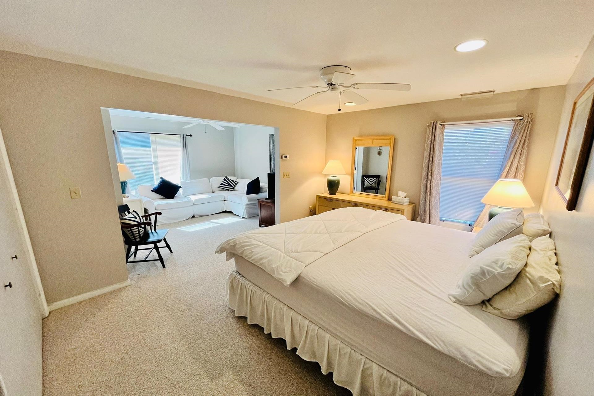 76 21st Street Avalon, NJ 08202 - Photo 12 of 18 a bedroom with bed and a chandelier