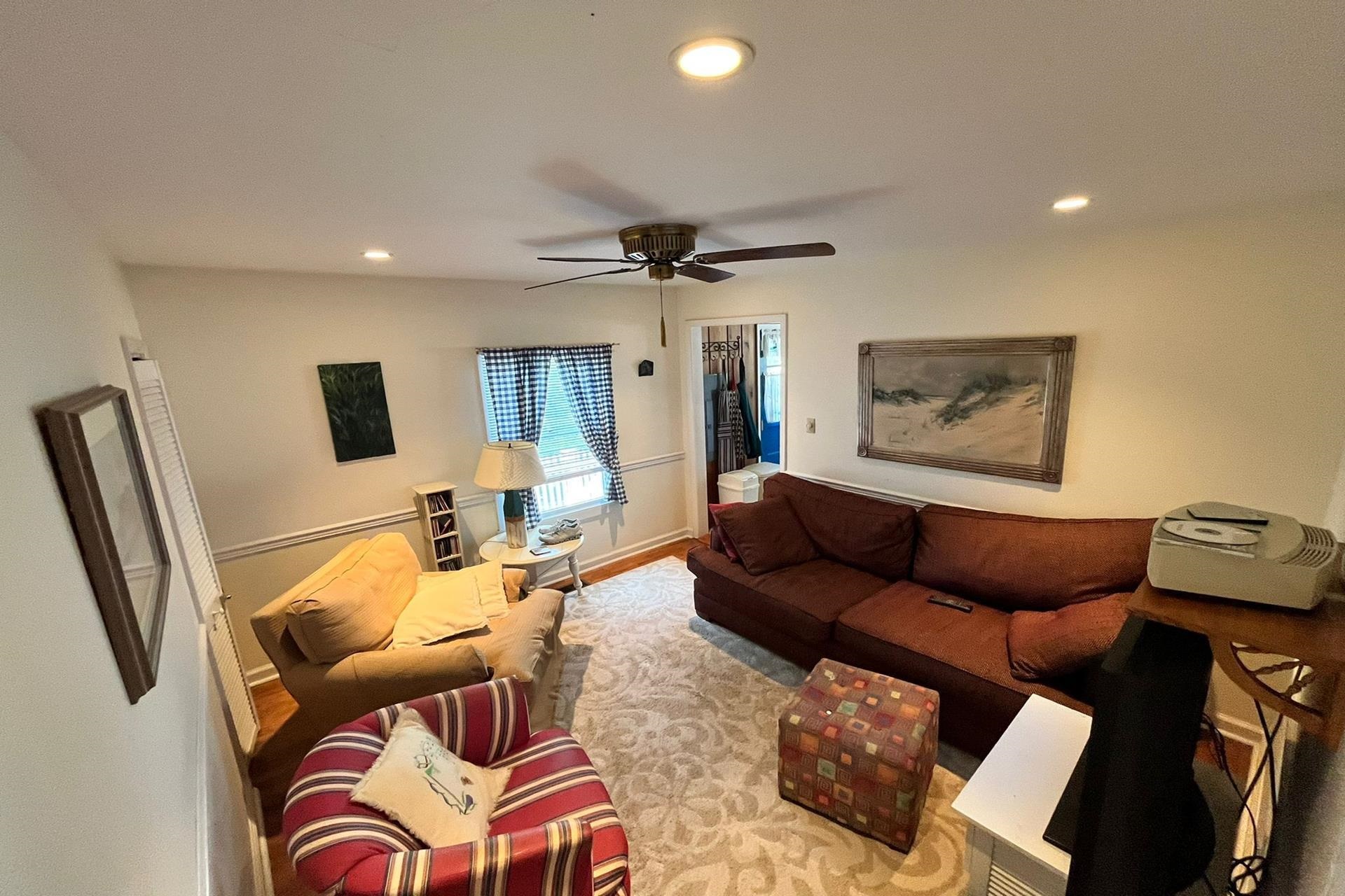 76 21st Street Avalon, NJ 08202 - Photo 17 of 18 a living room with furniture a flat screen tv and a window