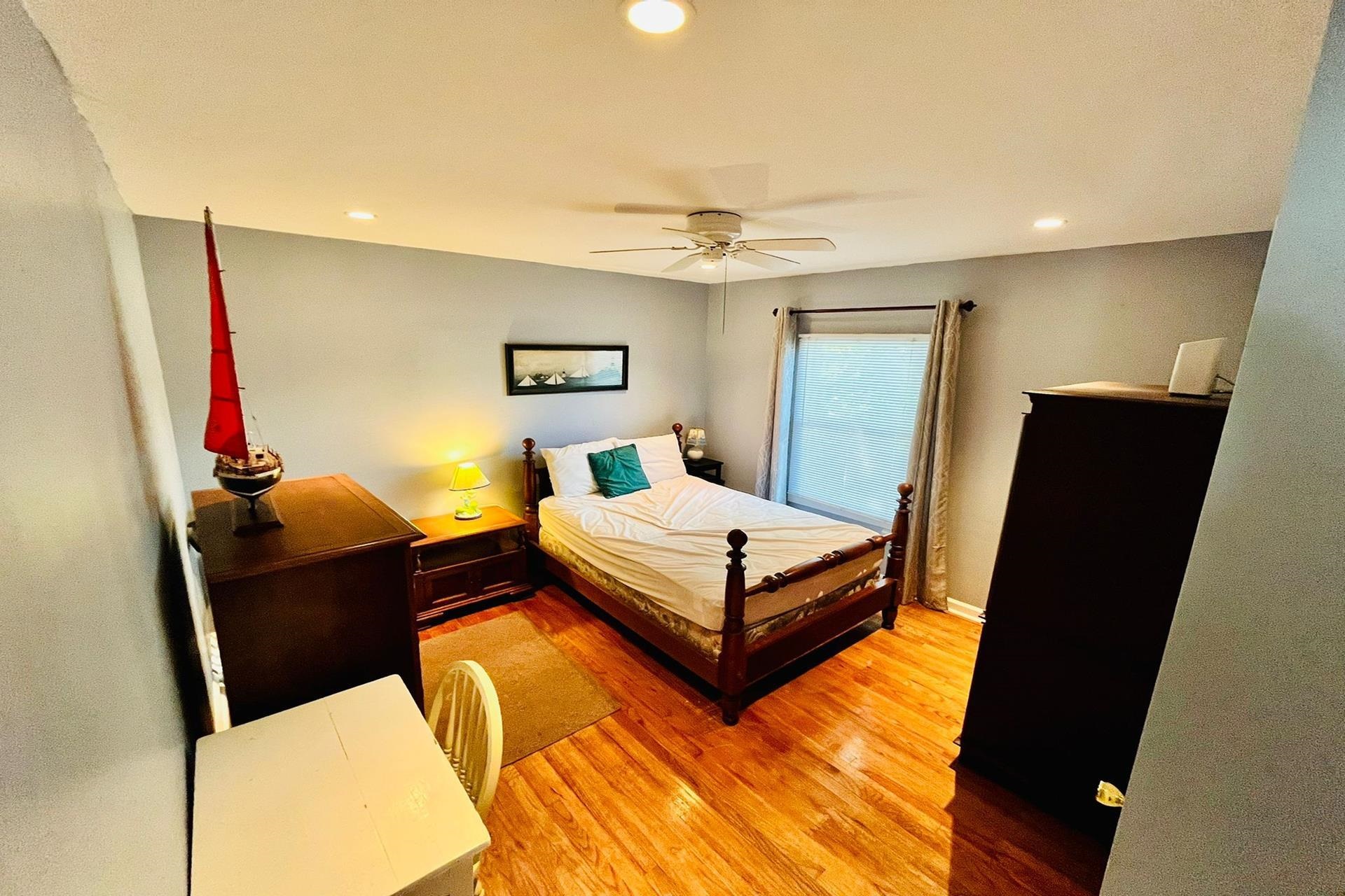 76 21st Street Avalon, NJ 08202 - Photo 5 of 18 a bedroom with a bed and wooden floor