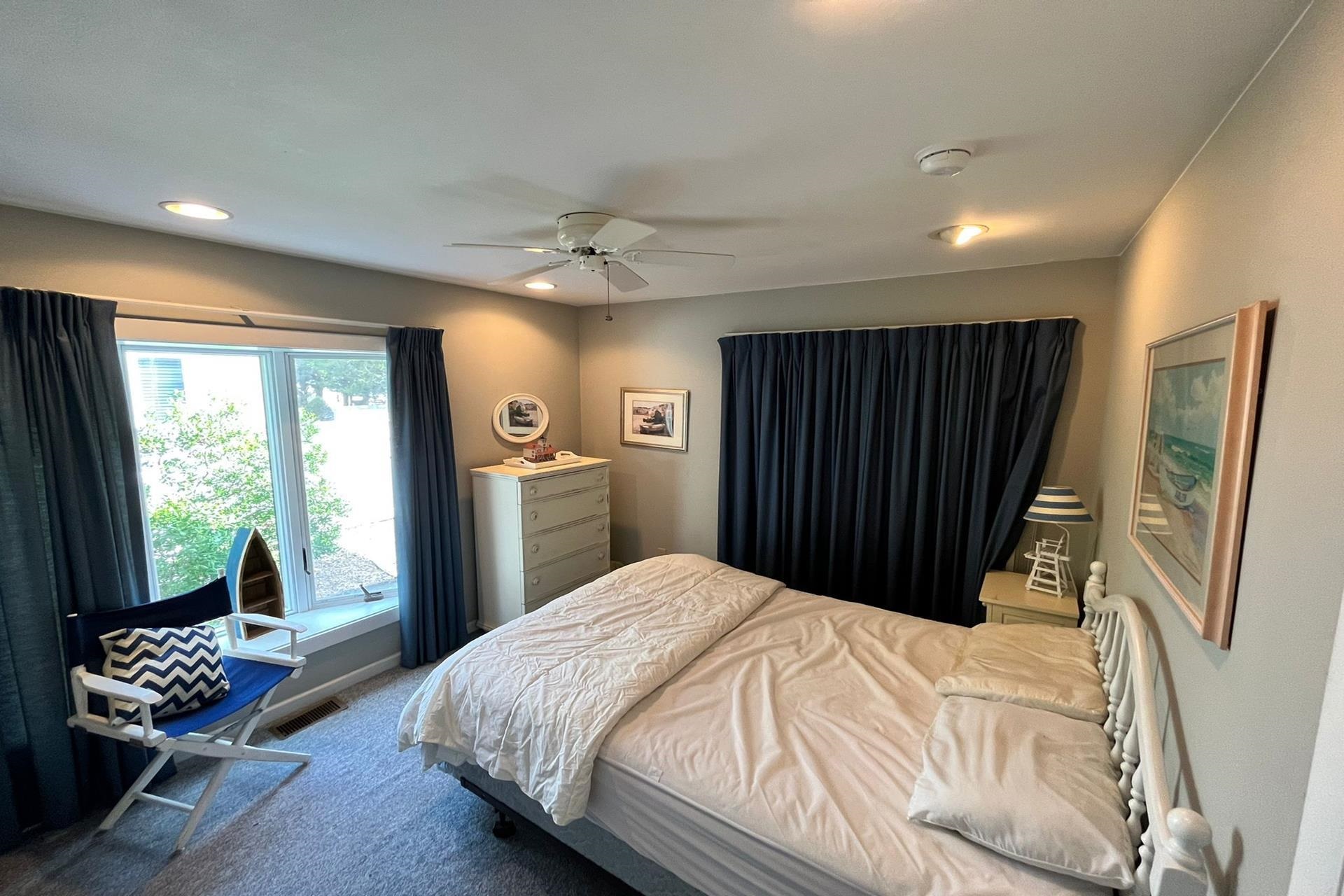 76 21st Street Avalon, NJ 08202 - Photo 7 of 18 a bed room with a bed and a window