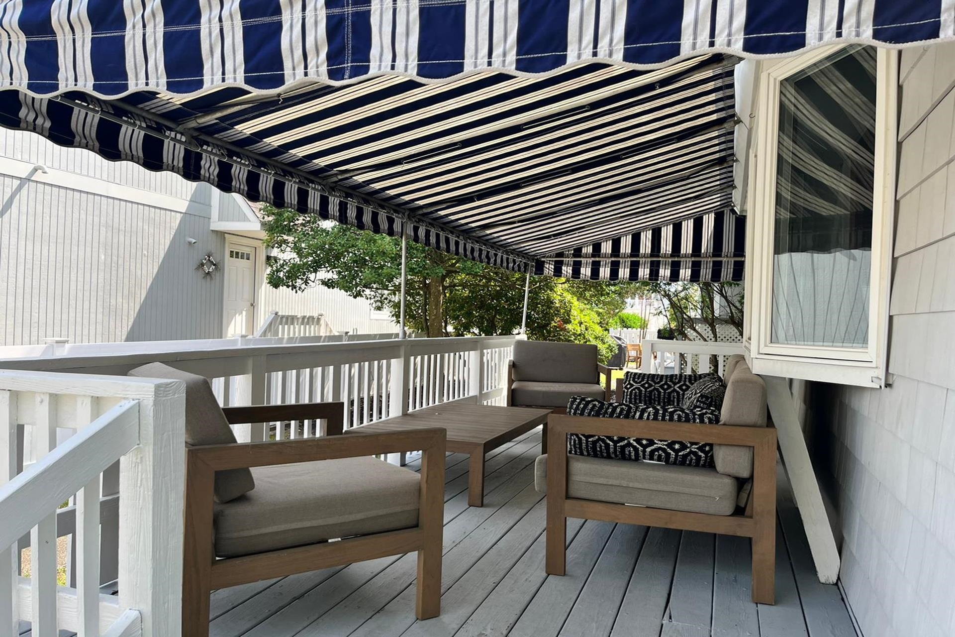 76 21st Street Avalon, NJ 08202 - Photo 8 of 18 a view of a patio with a table and chairs