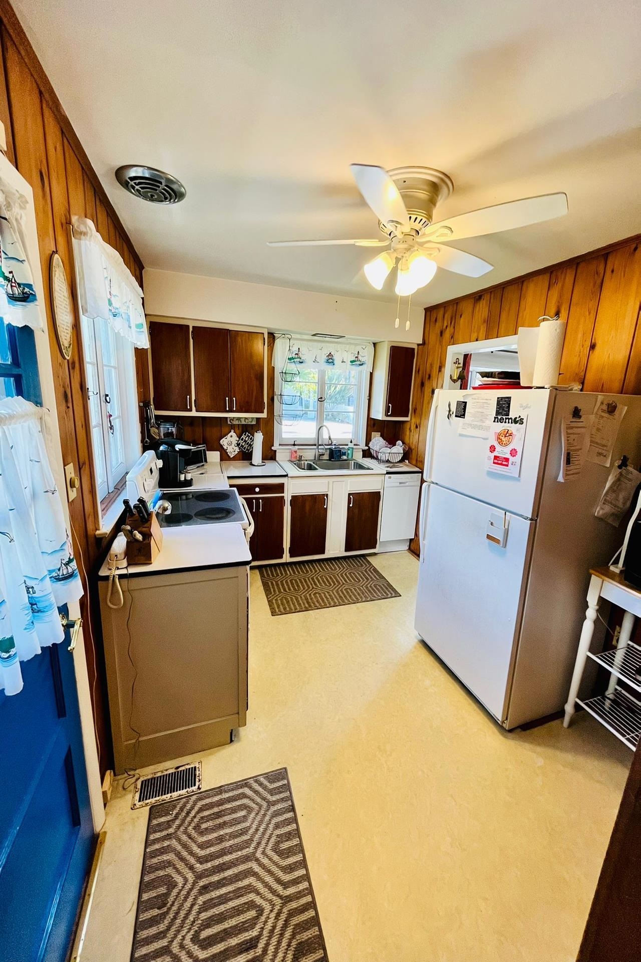 76 21st Street Avalon, NJ 08202 - Photo 9 of 18 a kitchen with refrigerator and microwave