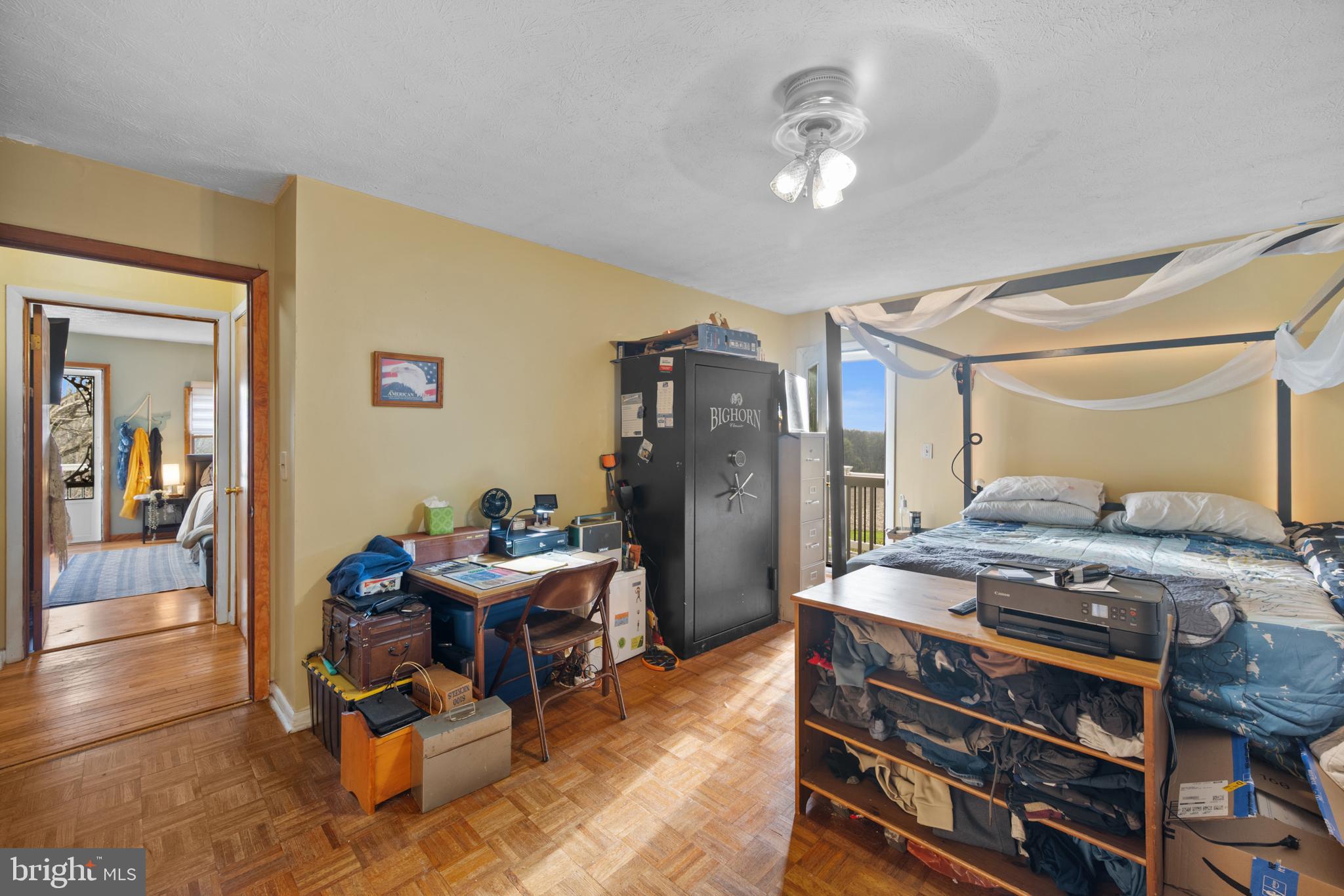 1908 Conowingo Road Rising Sun, MD 21911 - Photo 28 of 99 a bedroom with furniture and a chandelier