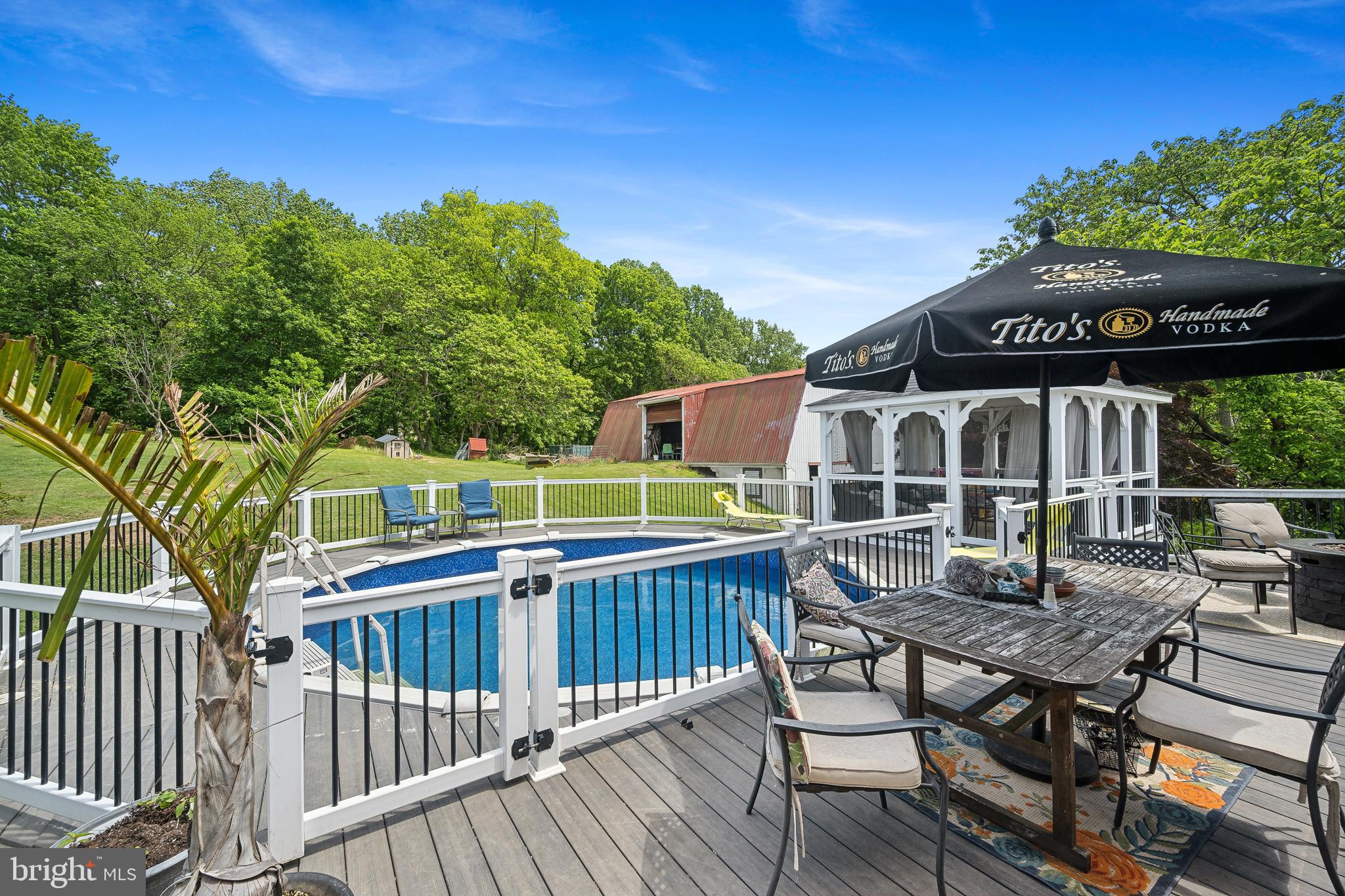 1908 Conowingo Road Rising Sun, MD 21911 - Photo 52 of 99 a roof deck with a table and chairs