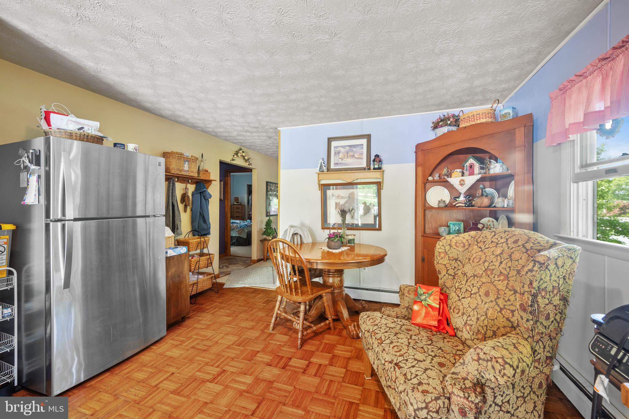 1908 Conowingo Road Rising Sun, MD 21911 - Photo 71 of 99 a living room with furniture a window and a refrigerator