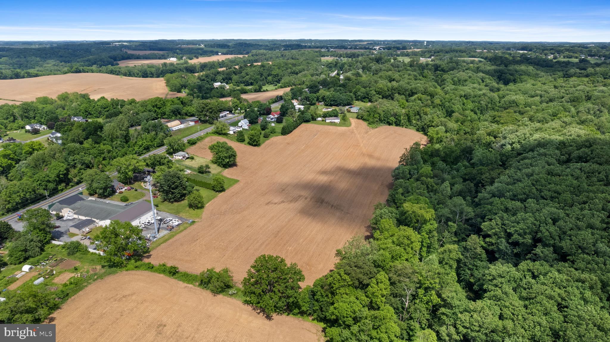 1908 Conowingo Road Rising Sun, MD 21911 - Photo 97 of 99 an aerial view of green landscape with trees houses and lake view