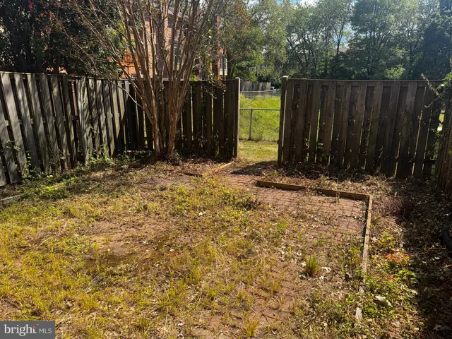 front view of a house with a fountain