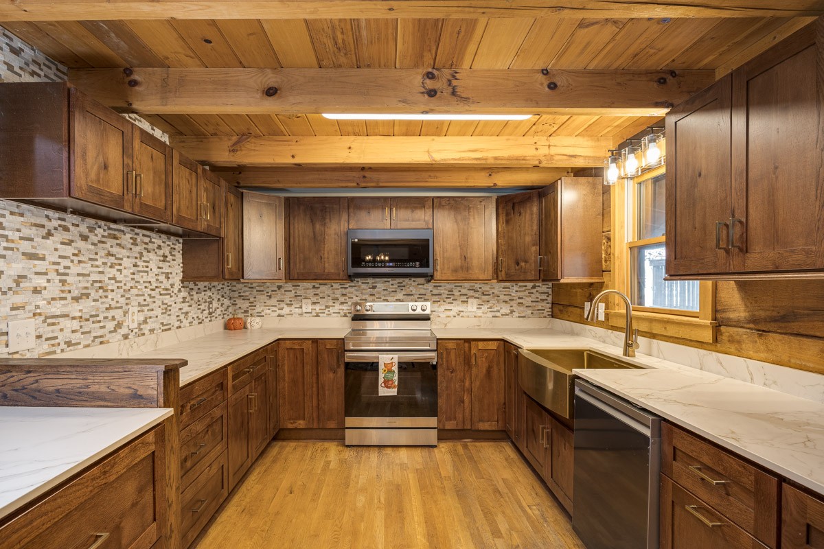 1762 Burke Hollow Road Nolensville, TN 37135 - Photo 12 of 52 a kitchen with stainless steel appliances granite countertop a sink a stove and a wooden floors