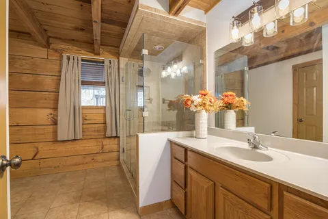 a bedroom with a large bed and a large window