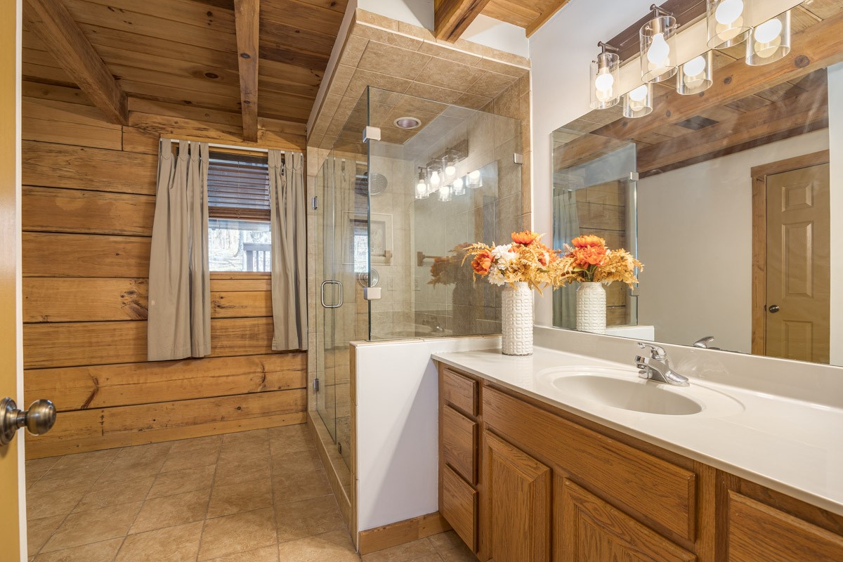 1762 Burke Hollow Road Nolensville, TN 37135 - Photo 19 of 52 a bathroom with a granite countertop sink a mirror and a shower