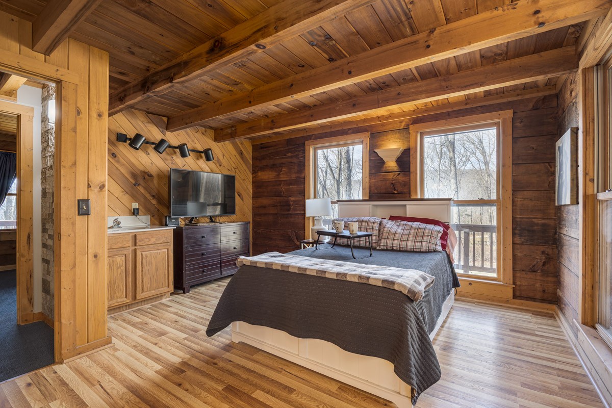 1762 Burke Hollow Road Nolensville, TN 37135 - Photo 20 of 52 a bedroom with a large bed and a large window