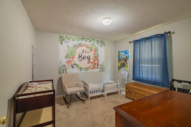 a area with a closet and a mirror