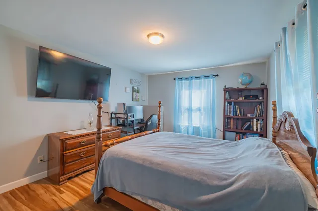 a bathroom with a sink mirror vanity and window