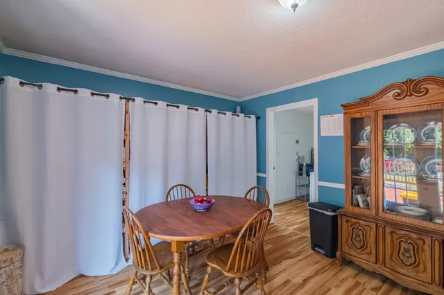 a bath room with a table and chairs