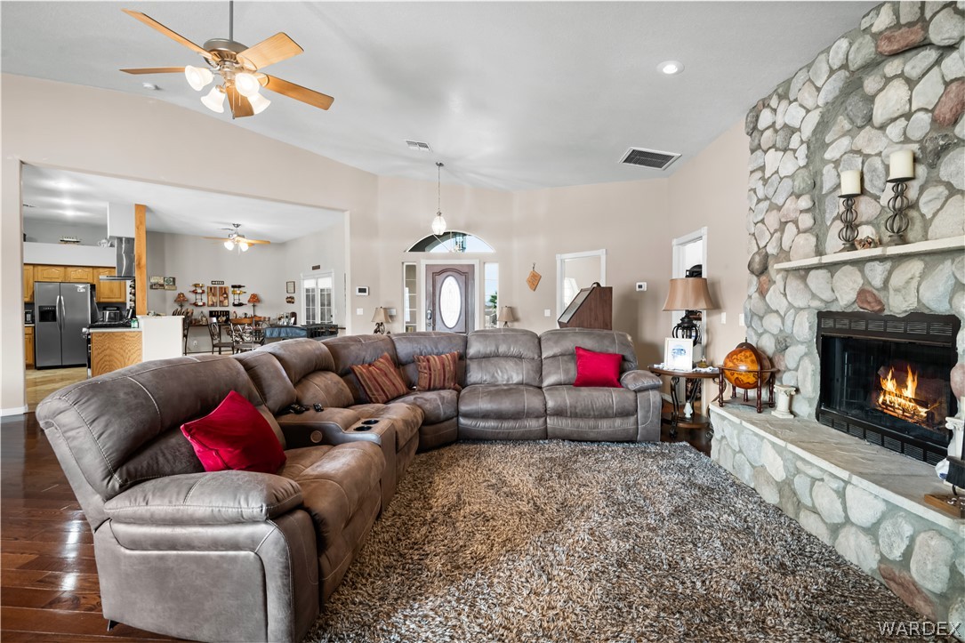 2898 Mountain Trail Road Kingman, AZ 86401 - Photo 5 of 75 a living room with furniture and a fireplace