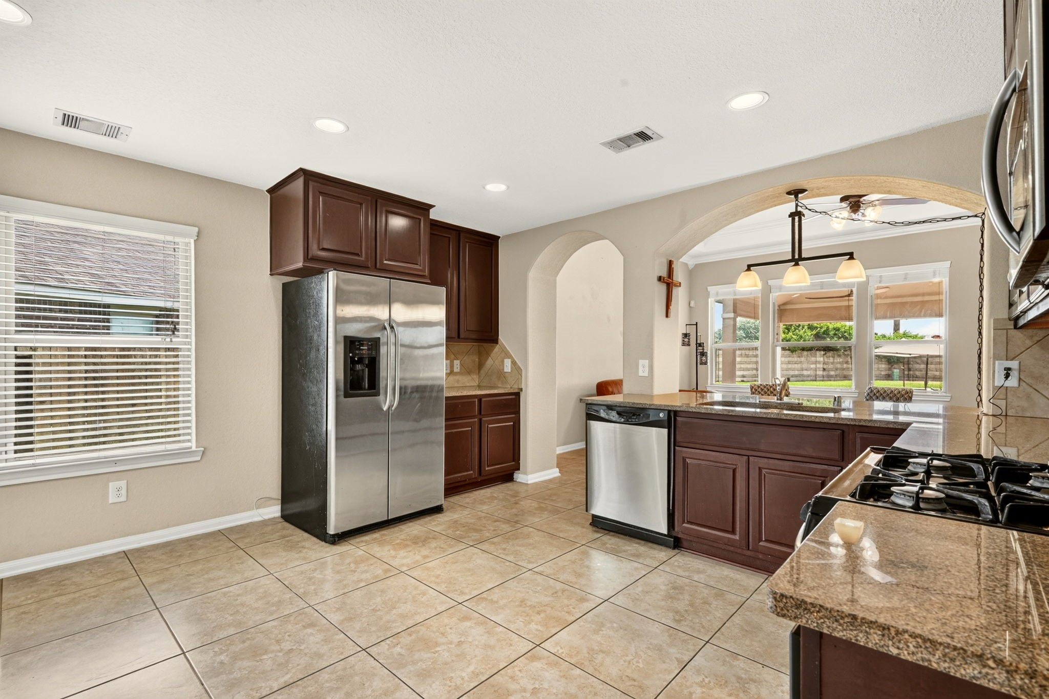6446 Tea Tree Drive Katy, TX 77494 - Photo 15 of 39 14x10 Kitchen -
Granite counters offer lots of room for prep. All the natural light makes for a really cheerful environment.
