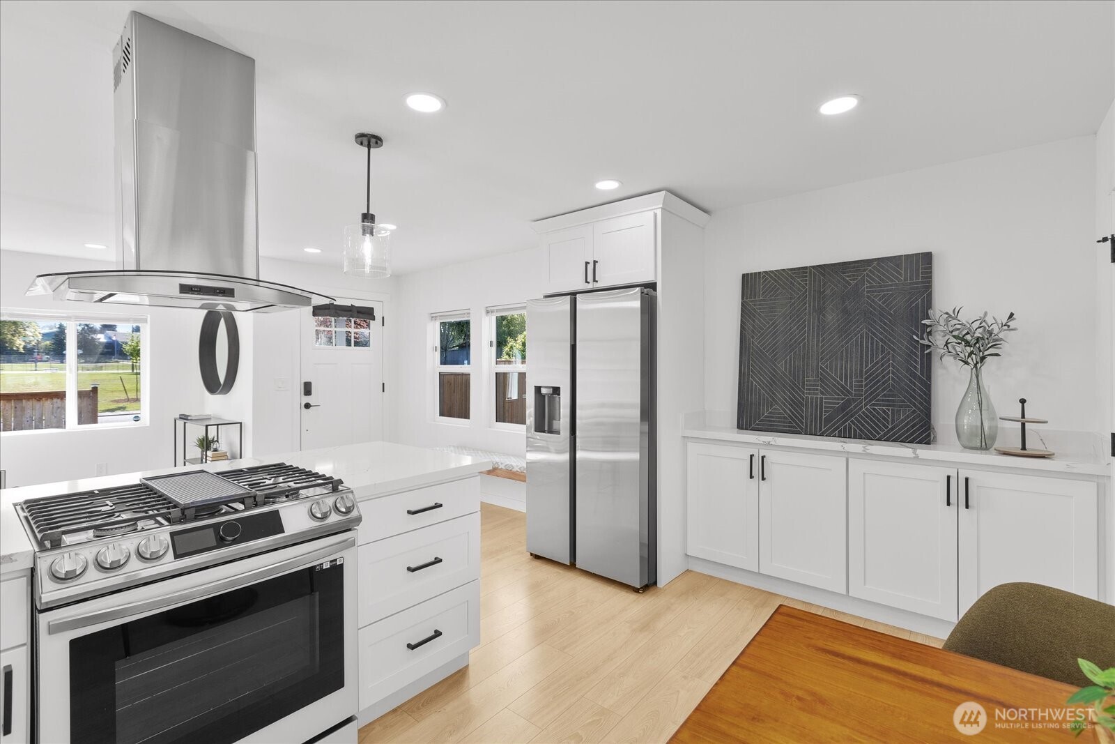 763 Edmonds Avenue Northeast Renton, WA 98056 - Photo 17 of 26 a kitchen with stainless steel appliances a stove a refrigerator and cabinets