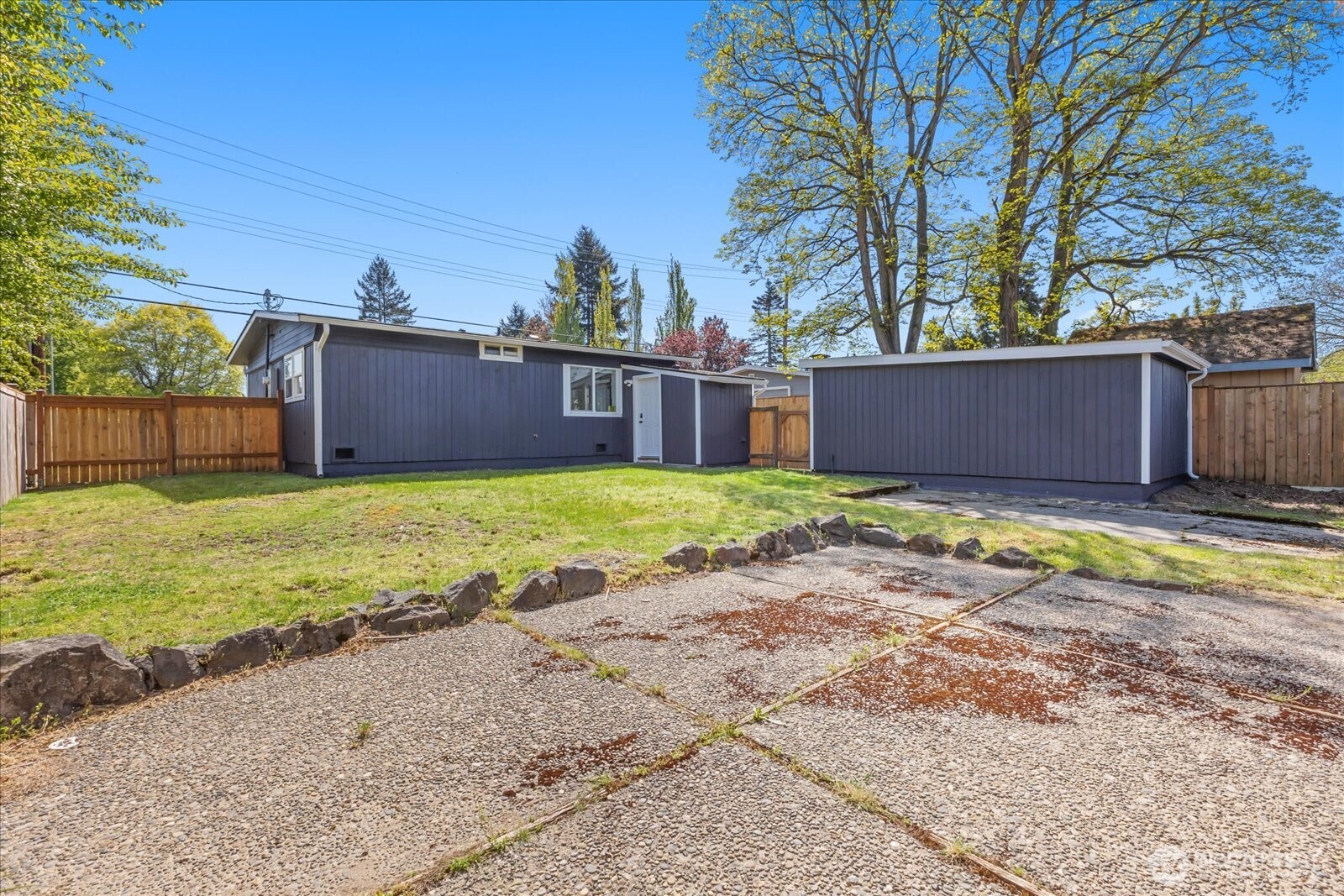 763 Edmonds Avenue Northeast Renton, WA 98056 - Photo 24 of 26 a view of a backyard with a small cabin
