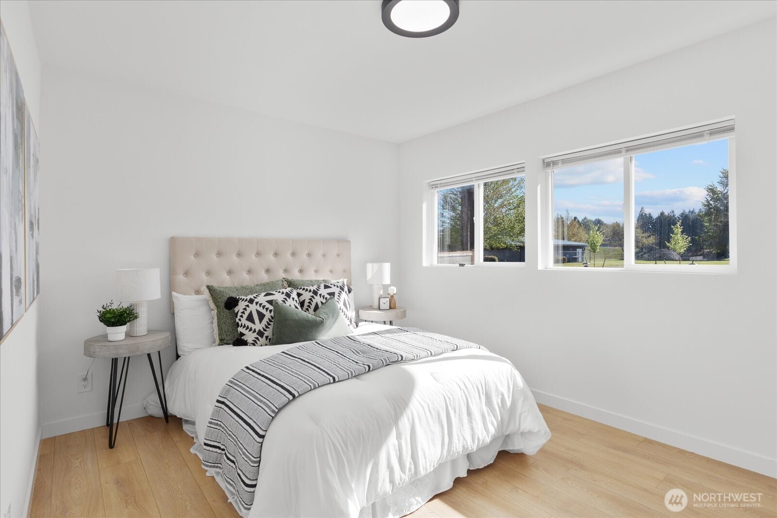 763 Edmonds Avenue Northeast Renton, WA 98056 - Photo 5 of 26 a bedroom with a bed and a window