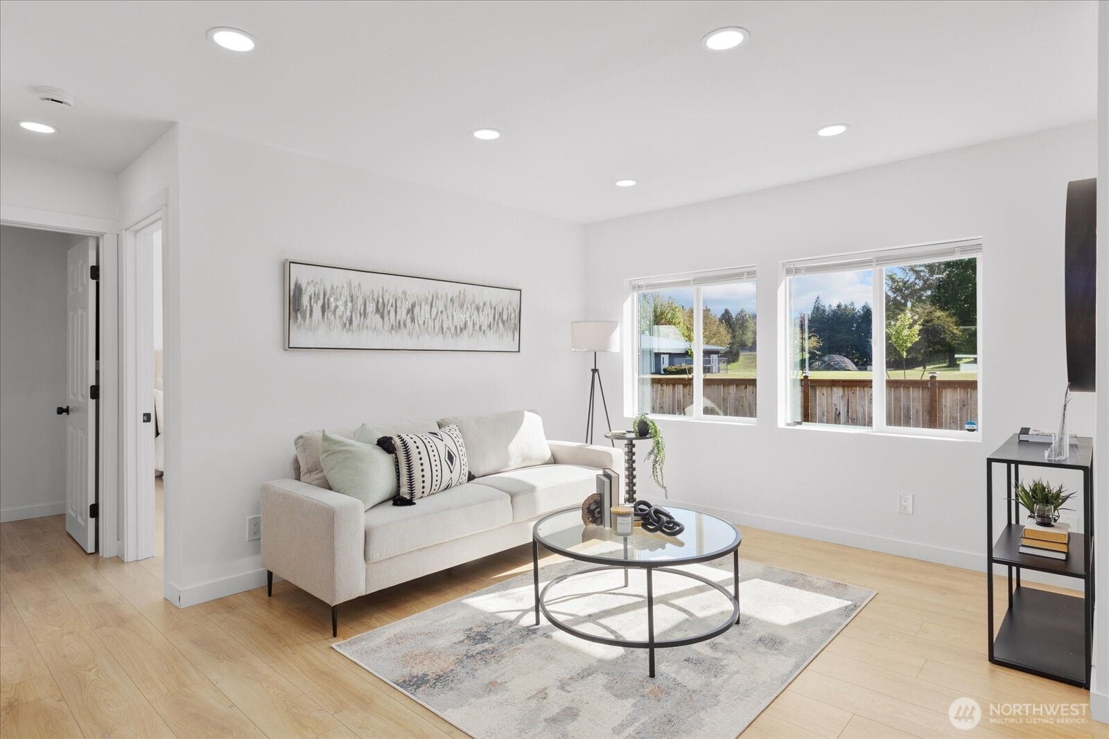 763 Edmonds Avenue Northeast Renton, WA 98056 - Photo 10 of 26 a living room with furniture and a large window