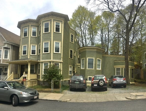 a view of a car parked in front of a house