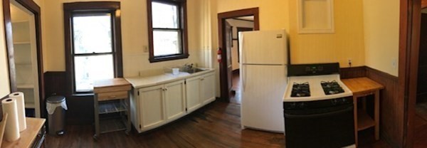 26 Tower Street Boston, MA 02130 - Photo 13 of 17 a kitchen with a sink stove and refrigerator