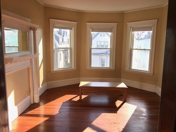 26 Tower Street Boston, MA 02130 - Photo 14 of 17 a living room with furniture and a window
