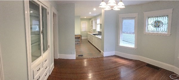 26 Tower Street Boston, MA 02130 - Photo 3 of 17 a view of a hallway with windows and chandelier