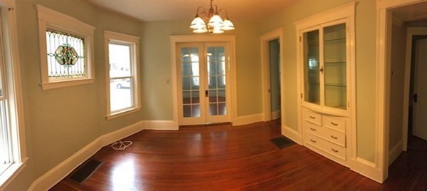 26 Tower Street Boston, MA 02130 - Photo 4 of 17 a view of an entryway with wooden floor and a front door