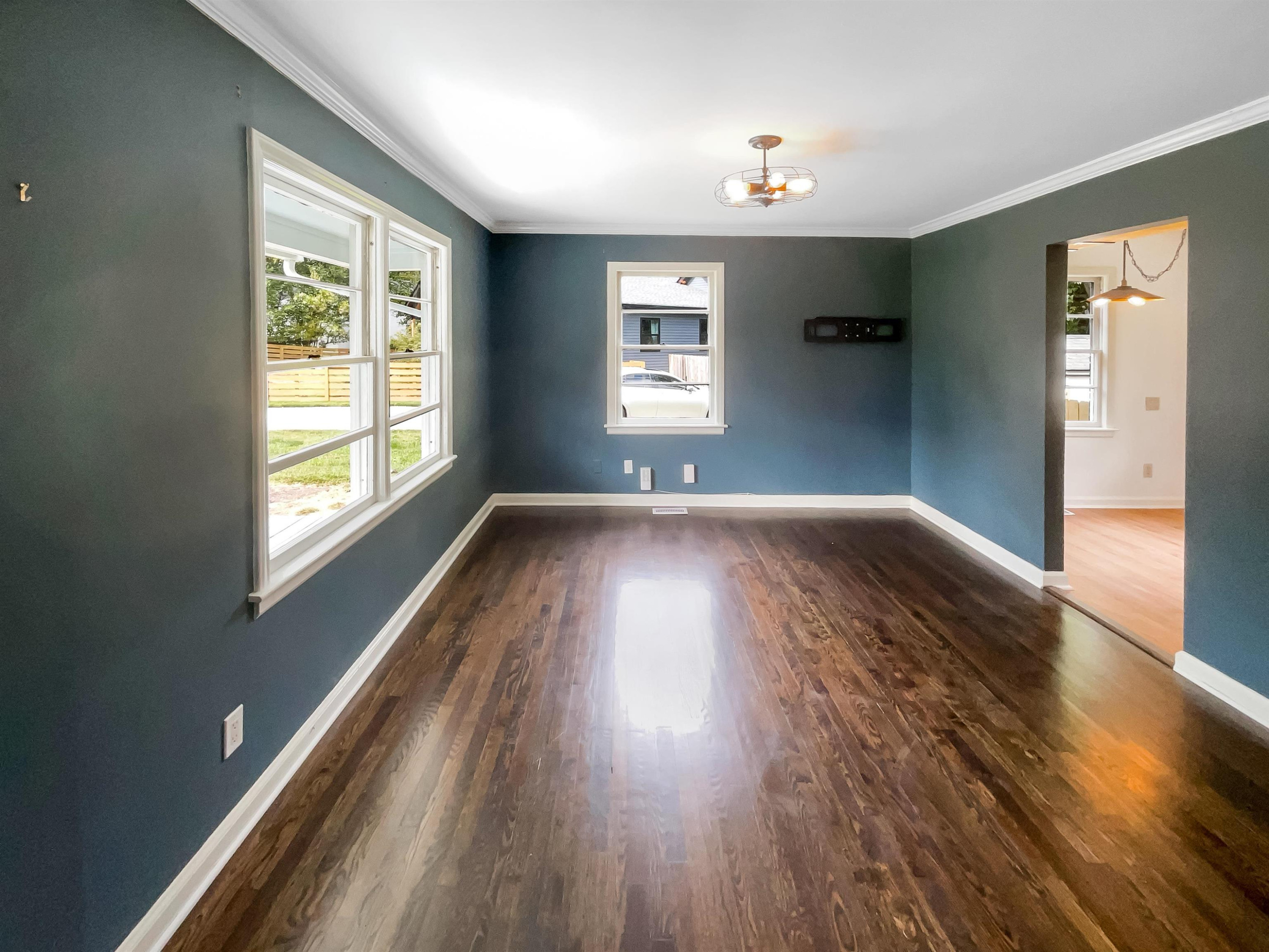 1108 Holburn Place Raleigh, NC 27610 - Photo 3 of 17 a view of an empty room with wooden floor and a window