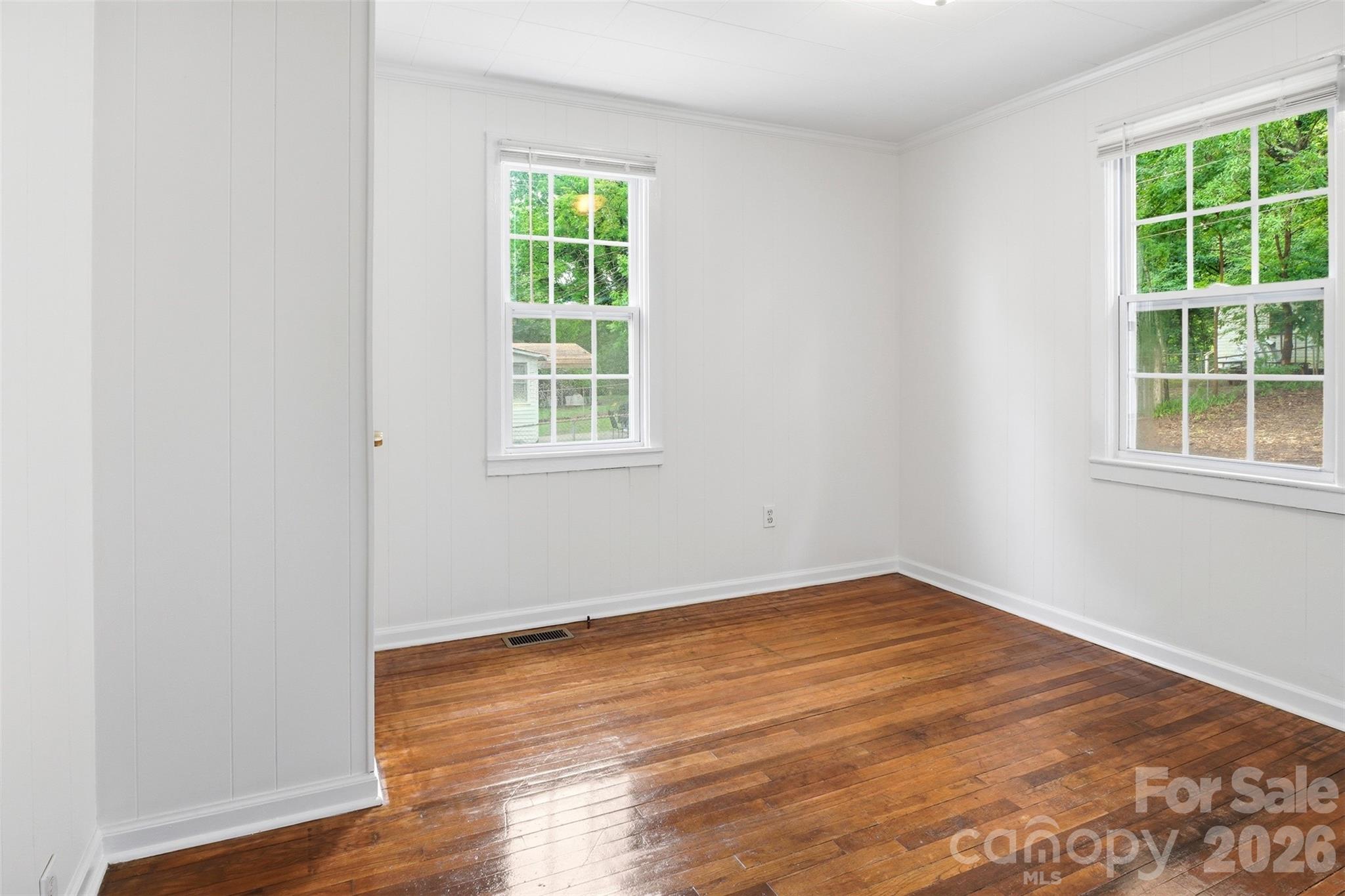 128 Ella Street Chester, SC 29706 - Photo 18 of 18 an empty room with wooden floor and windows