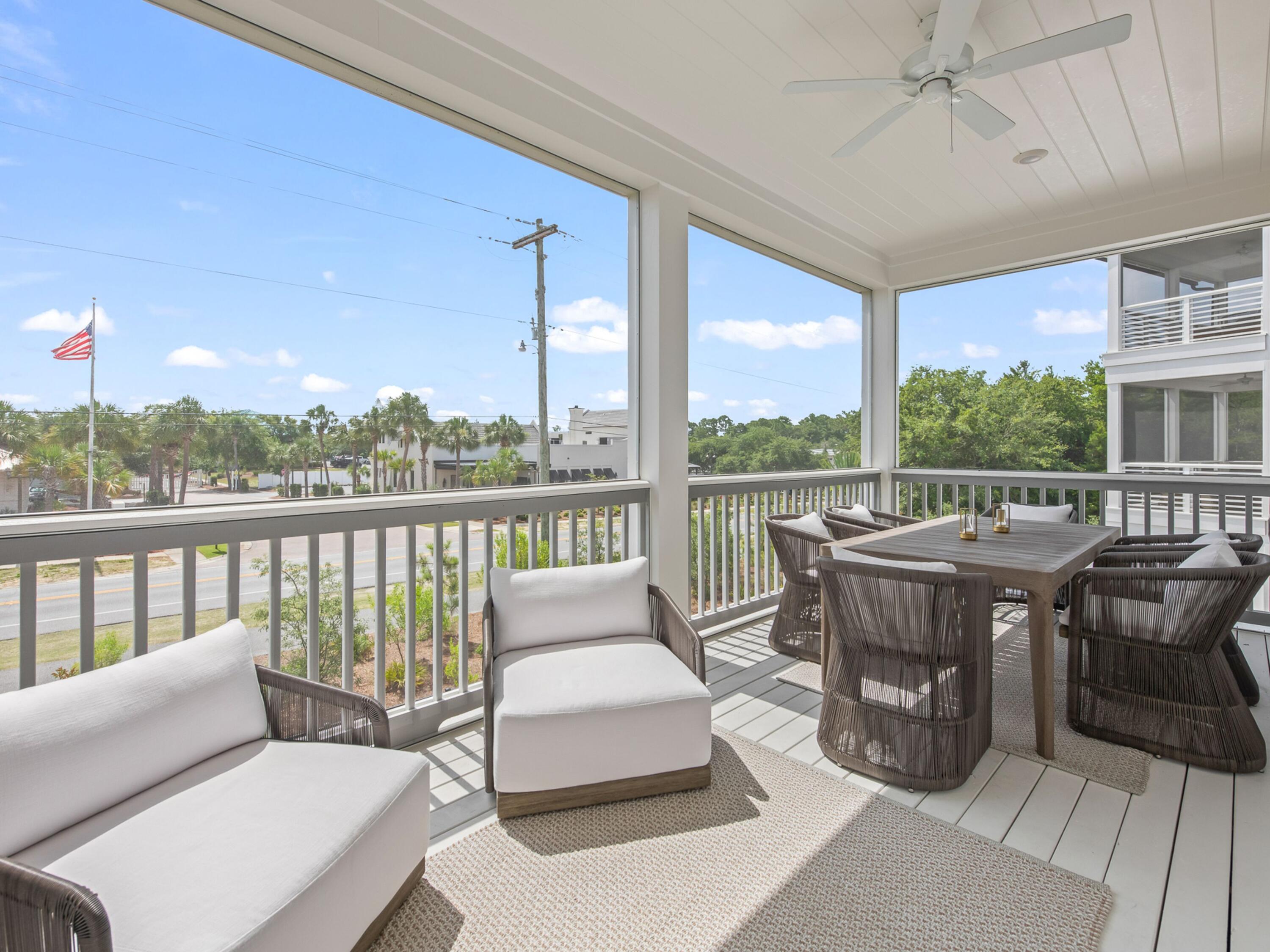 125 Seaboard Lane Santa Rosa Beach, FL 32459 - Photo 12 of 49 a balcony with furniture and a potted plant