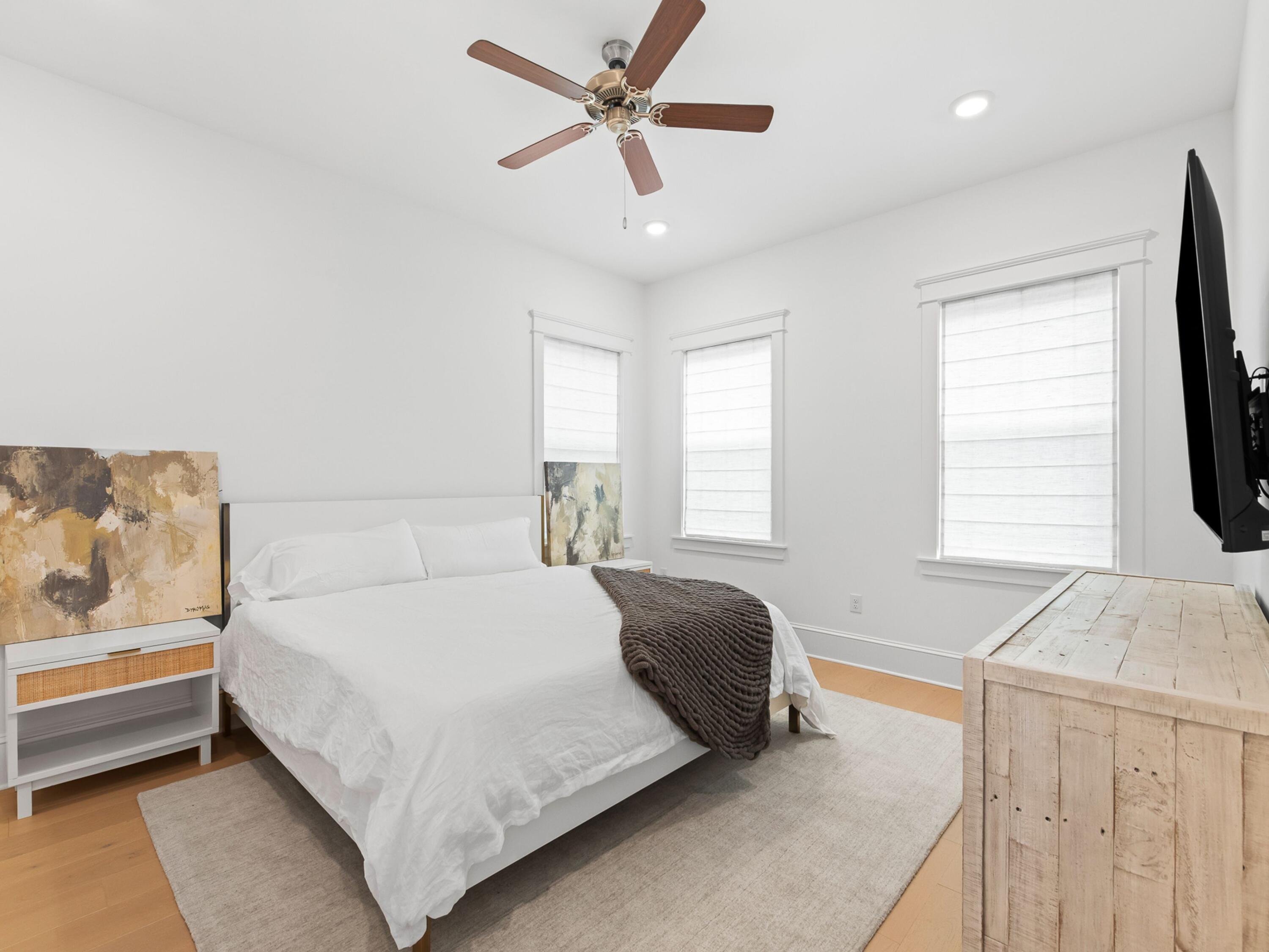 125 Seaboard Lane Santa Rosa Beach, FL 32459 - Photo 14 of 49 a bedroom with a bed and a flat screen tv