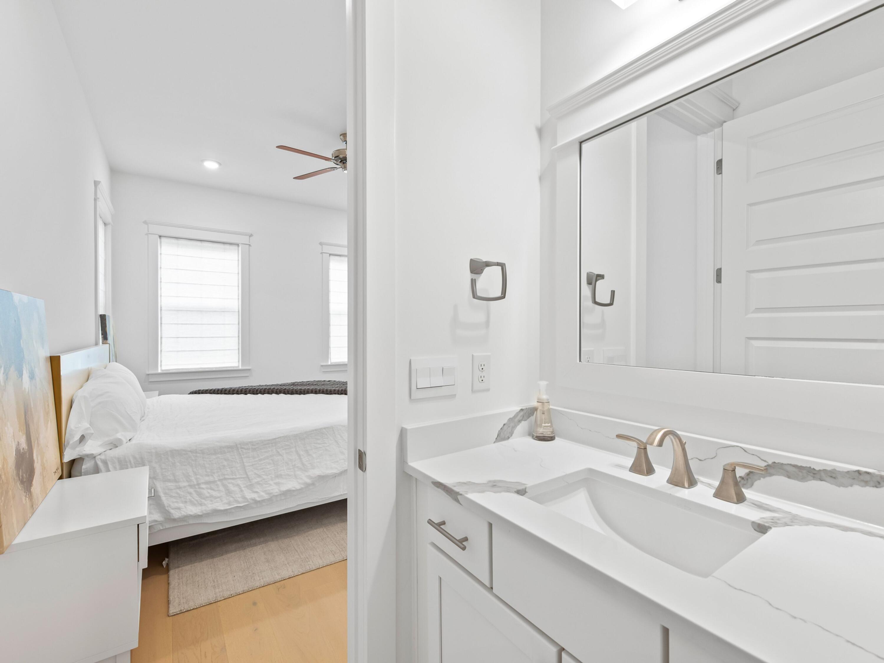 125 Seaboard Lane Santa Rosa Beach, FL 32459 - Photo 16 of 49 a bathroom with a tub sink and mirror