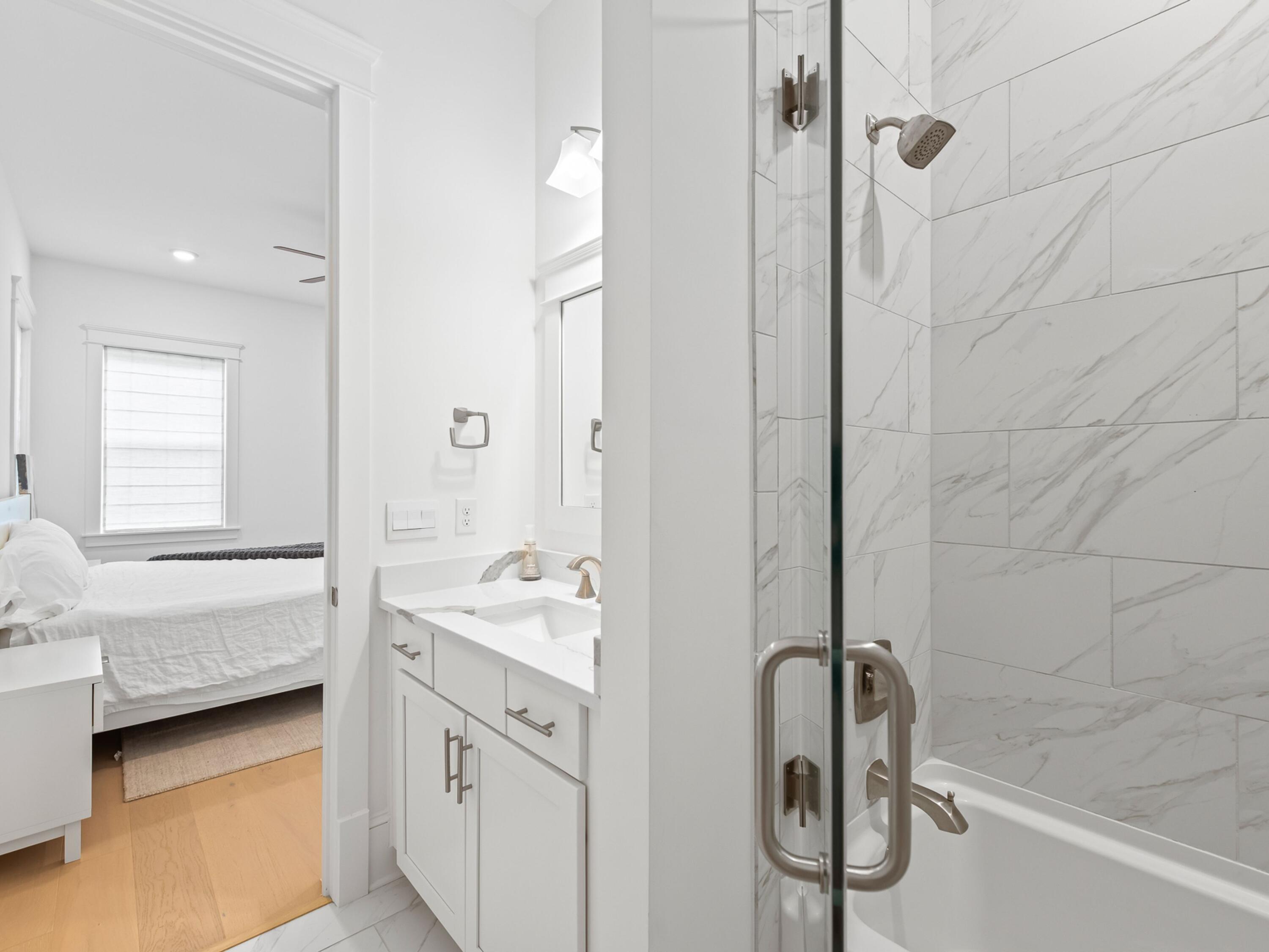 125 Seaboard Lane Santa Rosa Beach, FL 32459 - Photo 17 of 49 a bathroom with a tub sink and mirror