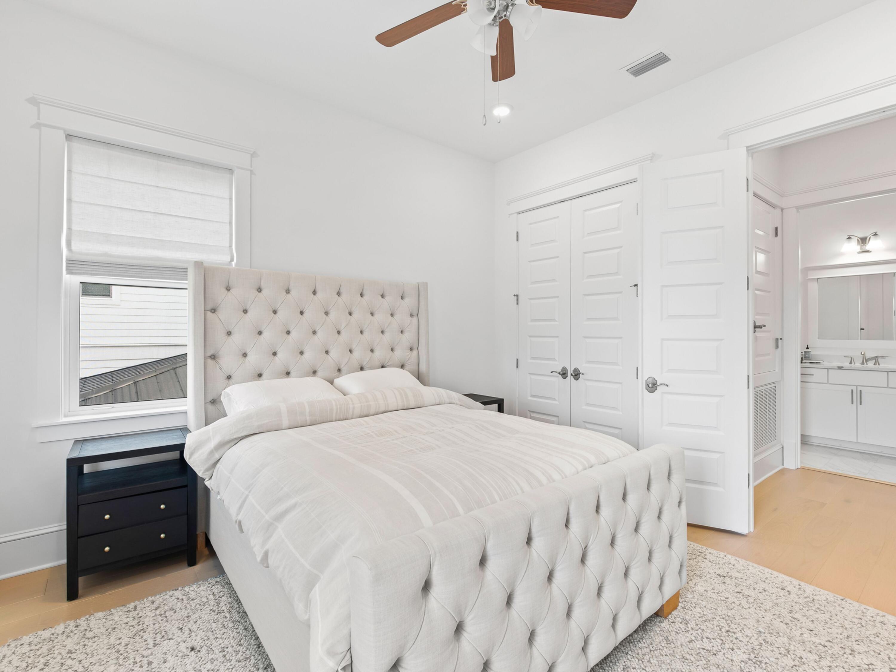 125 Seaboard Lane Santa Rosa Beach, FL 32459 - Photo 19 of 49 a bedroom with a bed and a dresser