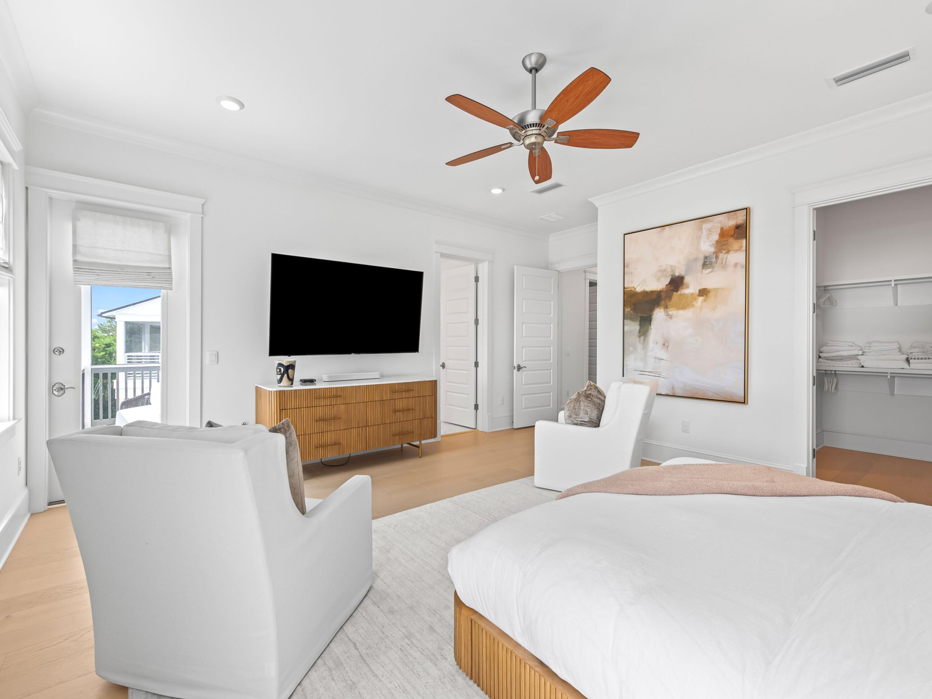 125 Seaboard Lane Santa Rosa Beach, FL 32459 - Photo 23 of 49 a bedroom with a bed and a flat screen tv