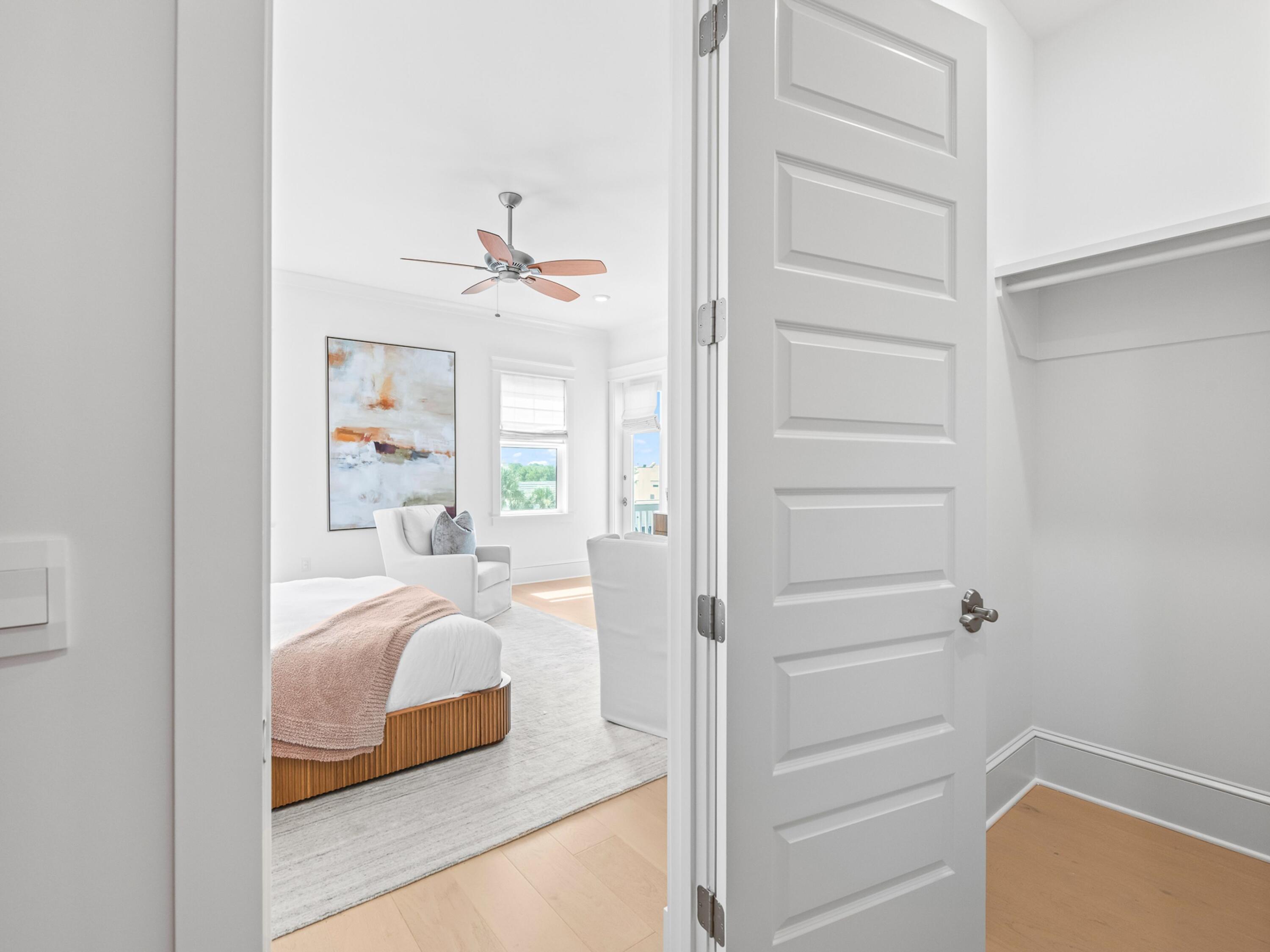 125 Seaboard Lane Santa Rosa Beach, FL 32459 - Photo 24 of 49 a bedroom with a bed and a hallway