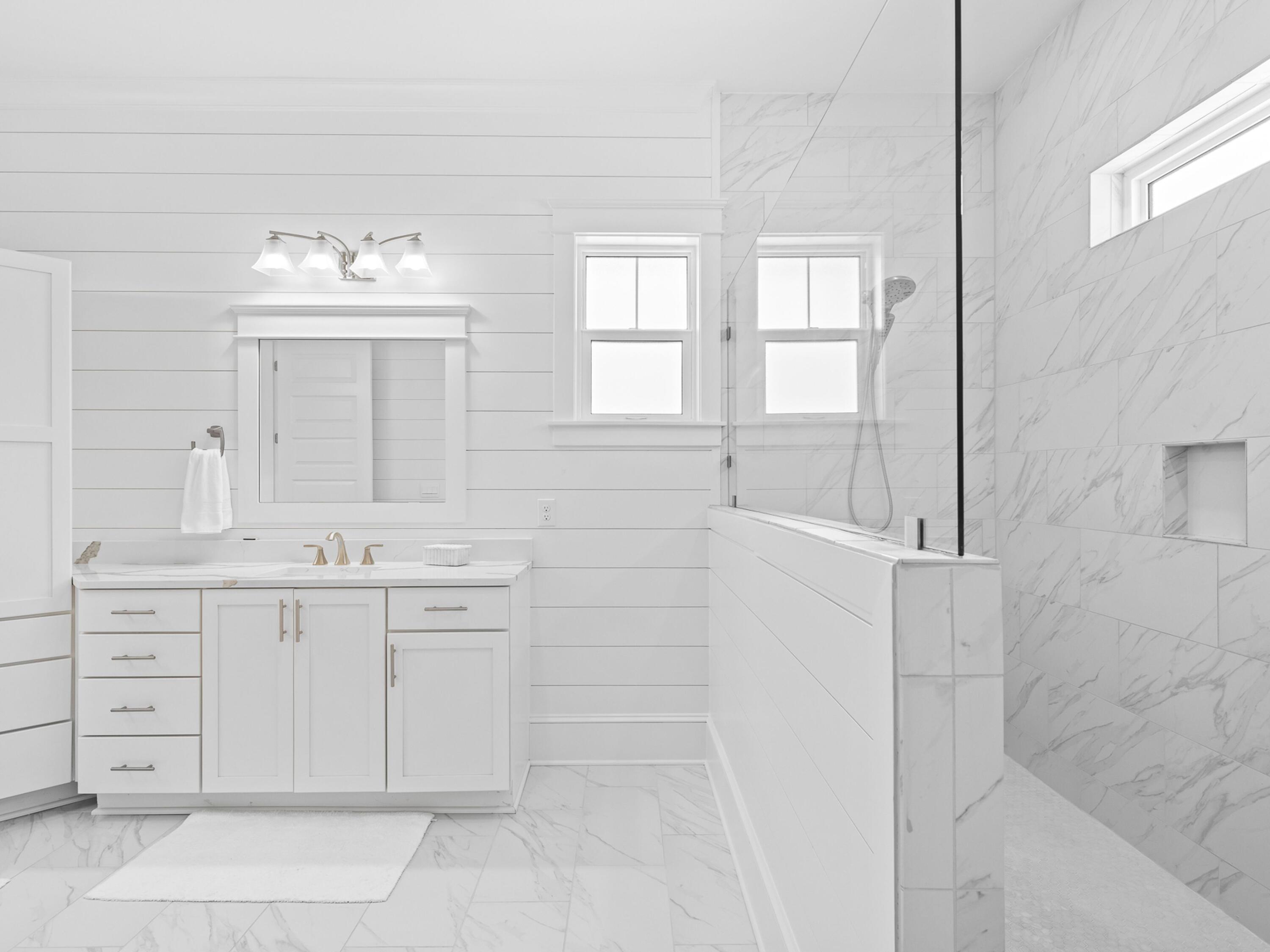 125 Seaboard Lane Santa Rosa Beach, FL 32459 - Photo 27 of 49 a bathroom with a double vanity sink mirror and