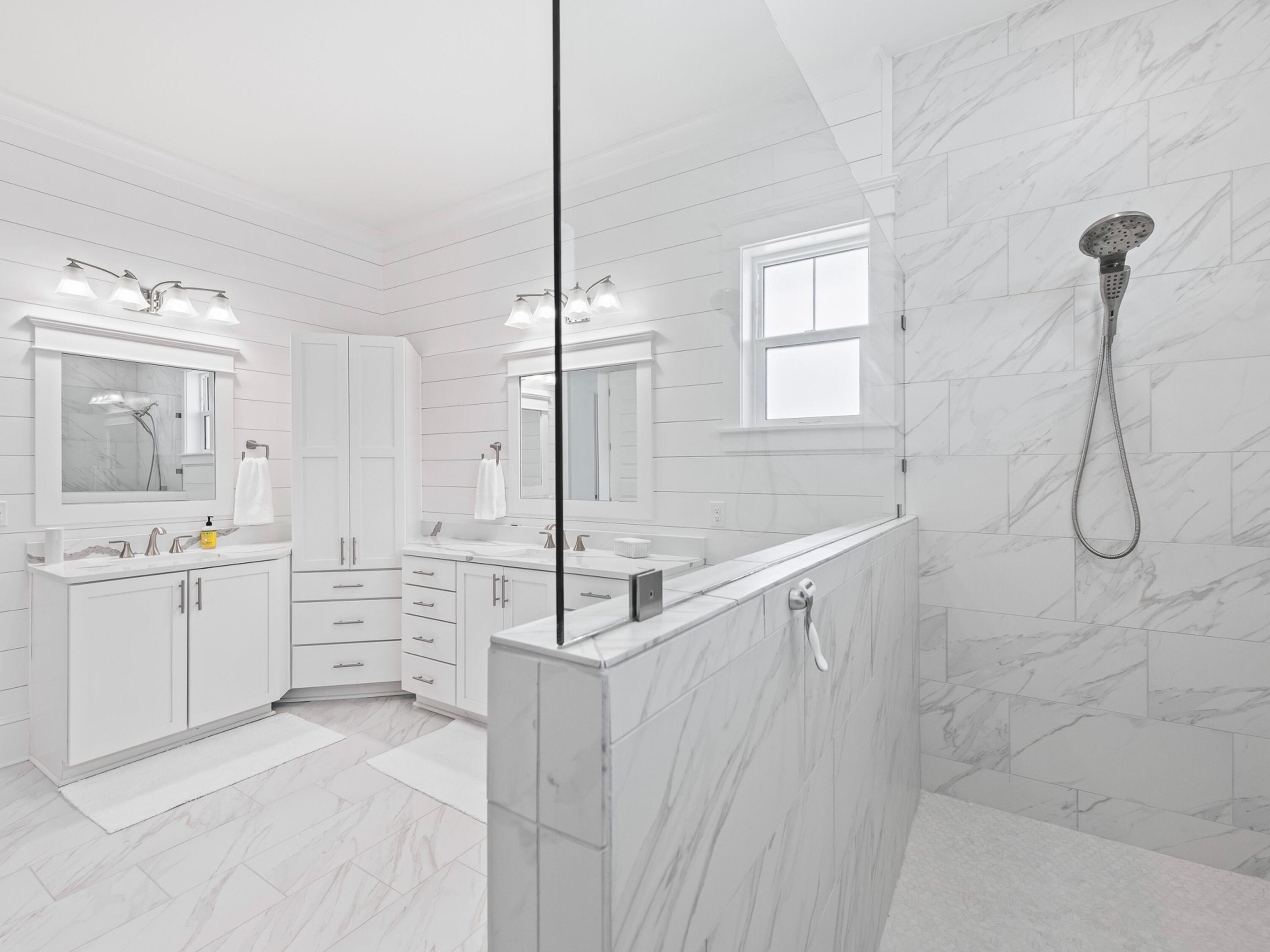 125 Seaboard Lane Santa Rosa Beach, FL 32459 - Photo 28 of 49 a bathroom with a tub sink and mirror