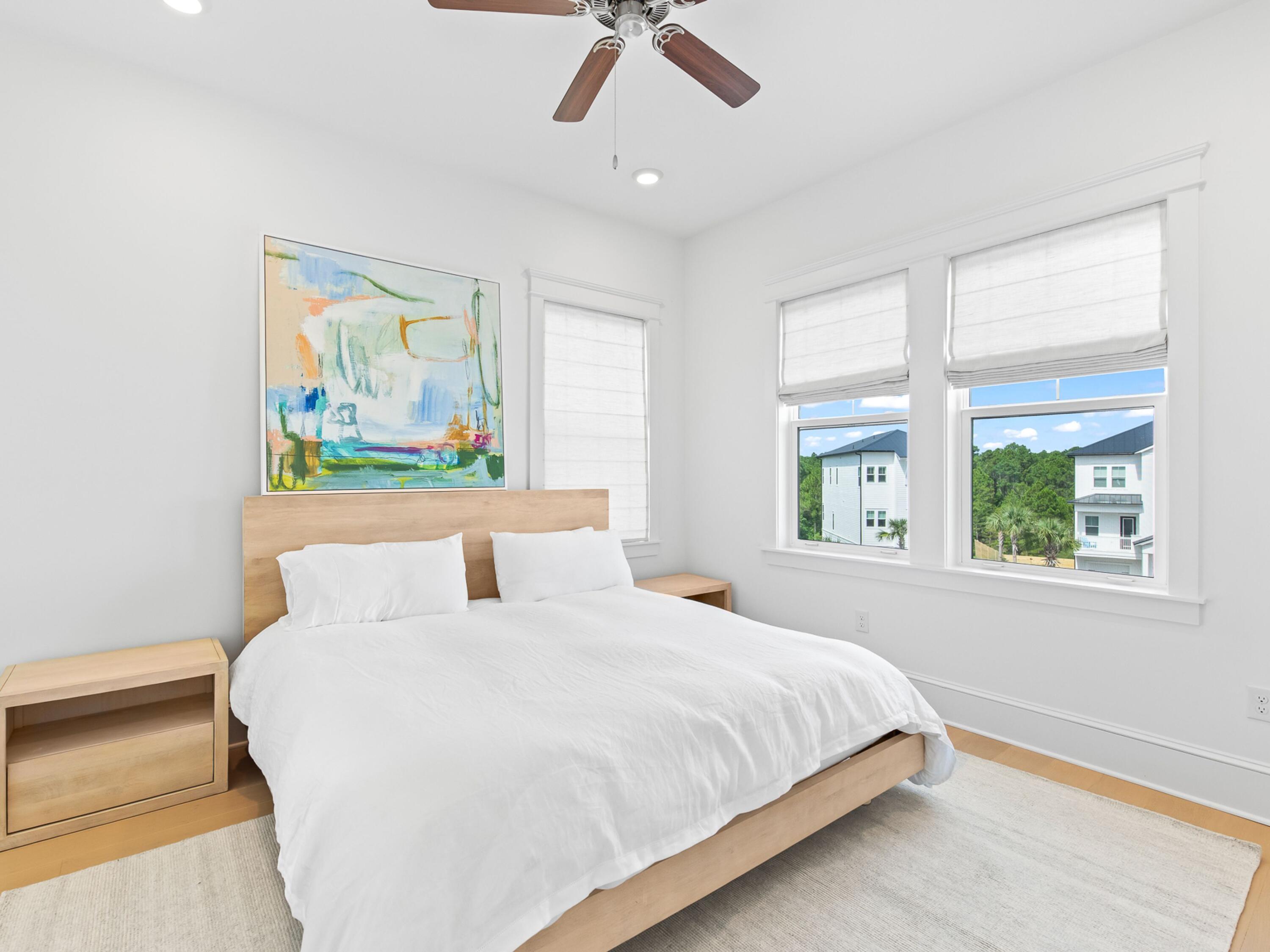 125 Seaboard Lane Santa Rosa Beach, FL 32459 - Photo 30 of 49 a bedroom with a bed and a painting on the wall