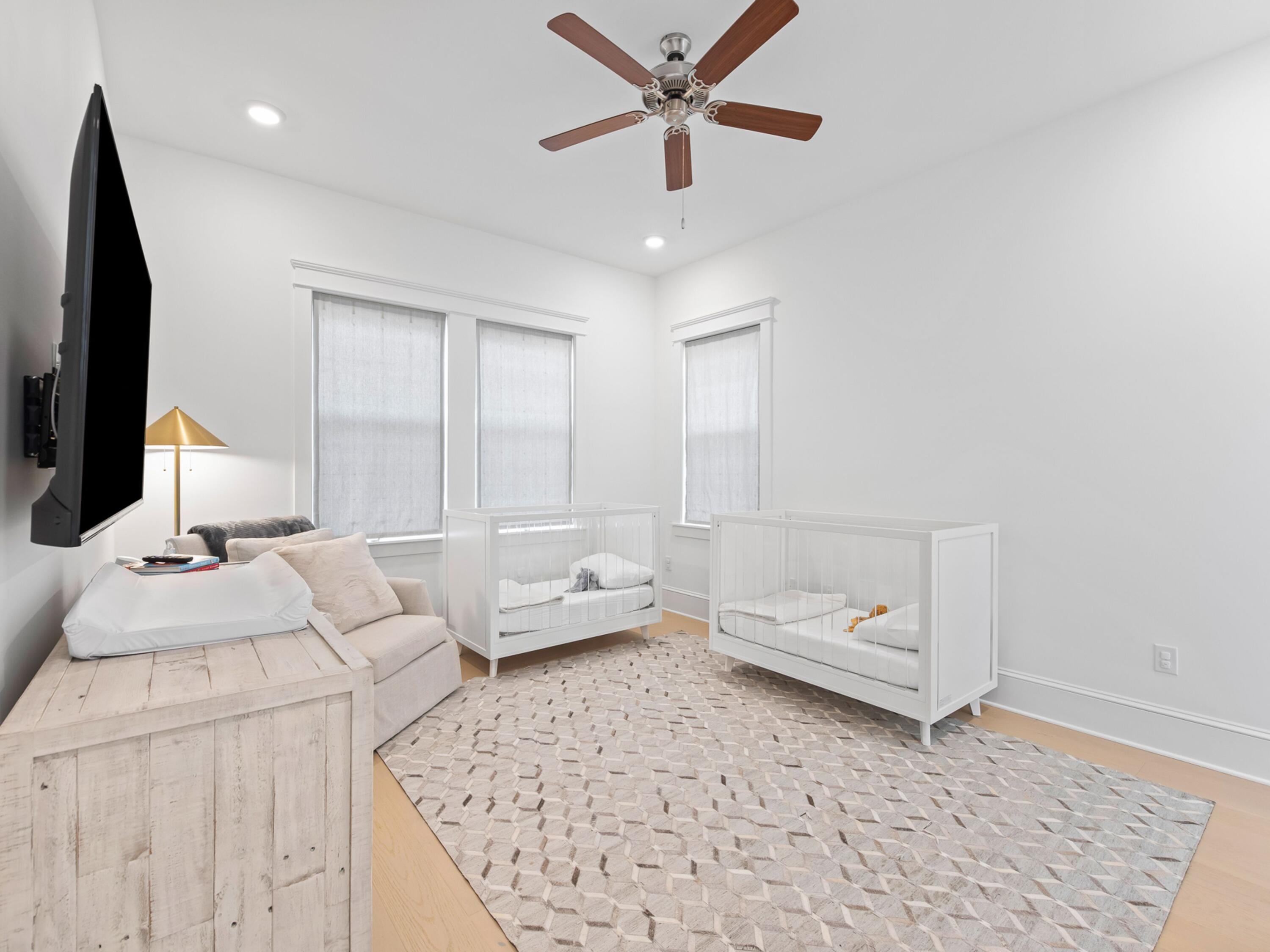 125 Seaboard Lane Santa Rosa Beach, FL 32459 - Photo 33 of 49 a living room with furniture and a flat screen tv