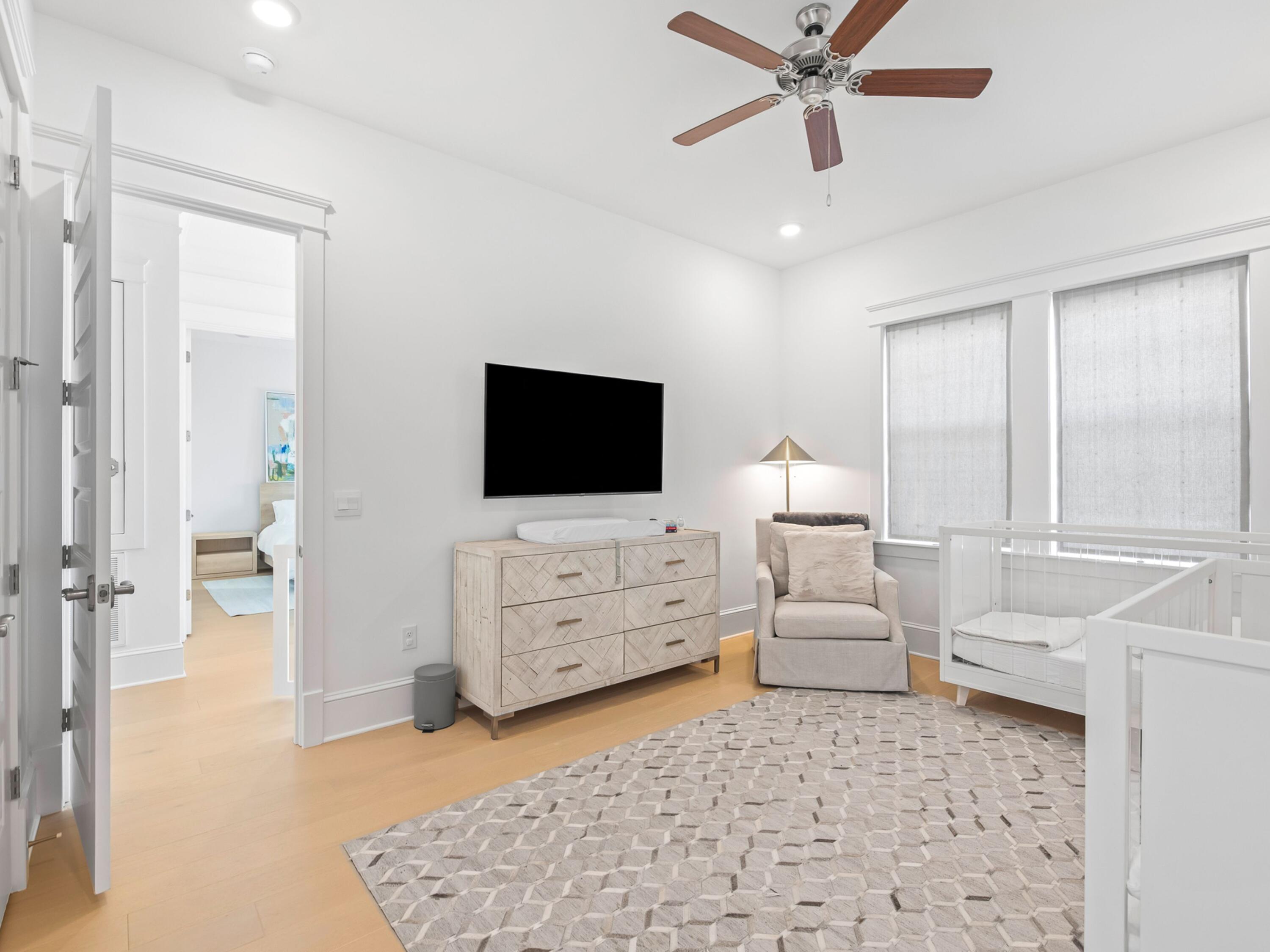 125 Seaboard Lane Santa Rosa Beach, FL 32459 - Photo 35 of 49 a living room with furniture and a flat screen tv