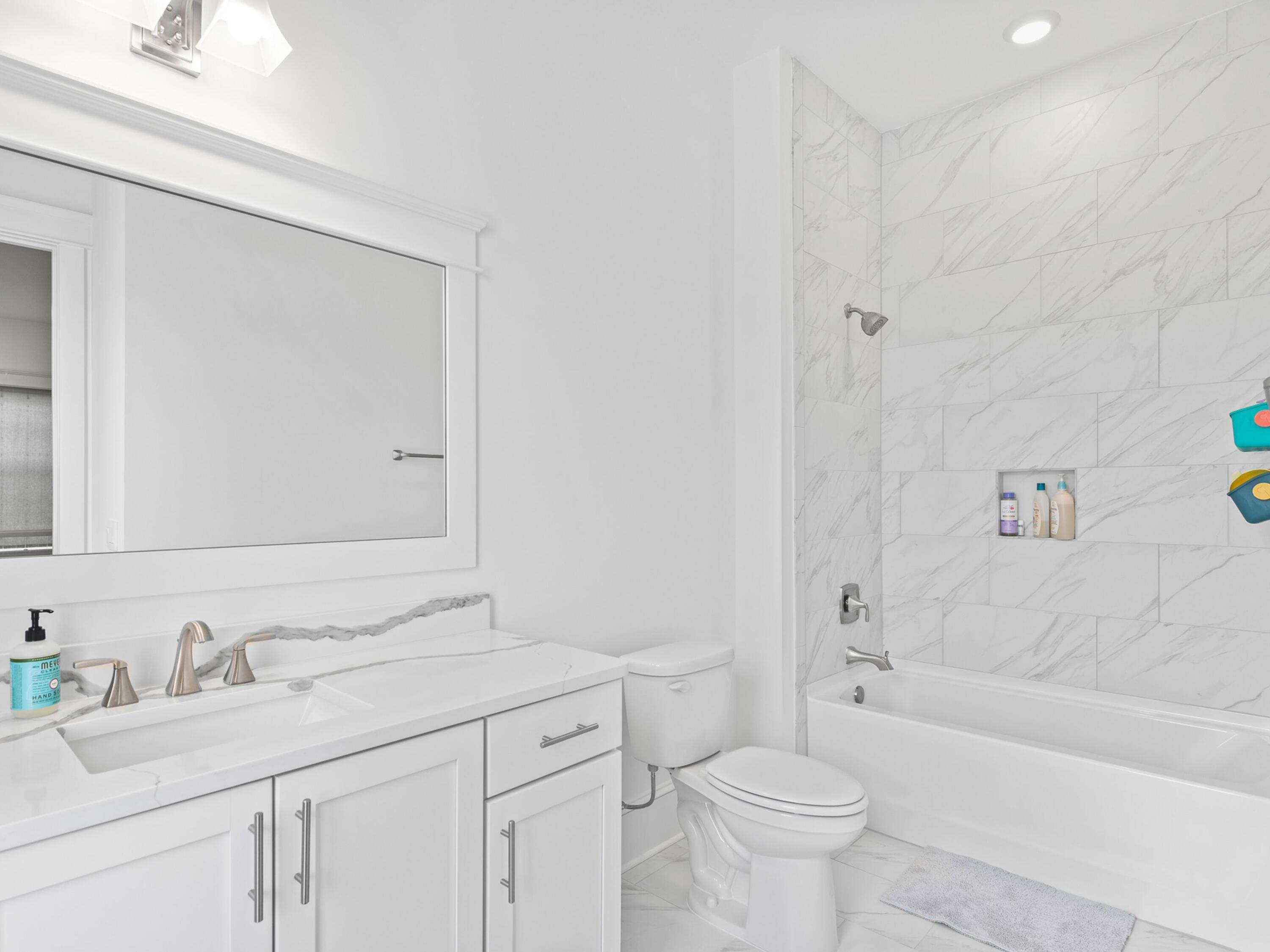 125 Seaboard Lane Santa Rosa Beach, FL 32459 - Photo 36 of 49 a bathroom with a sink a toilet and a bathtub