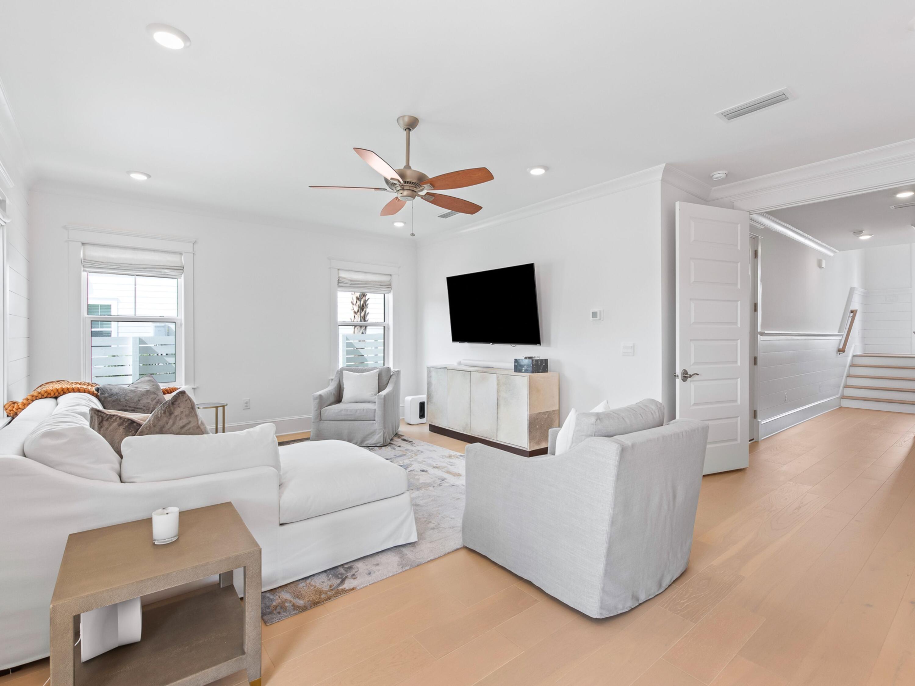 125 Seaboard Lane Santa Rosa Beach, FL 32459 - Photo 41 of 49 a living room with furniture and a flat screen tv