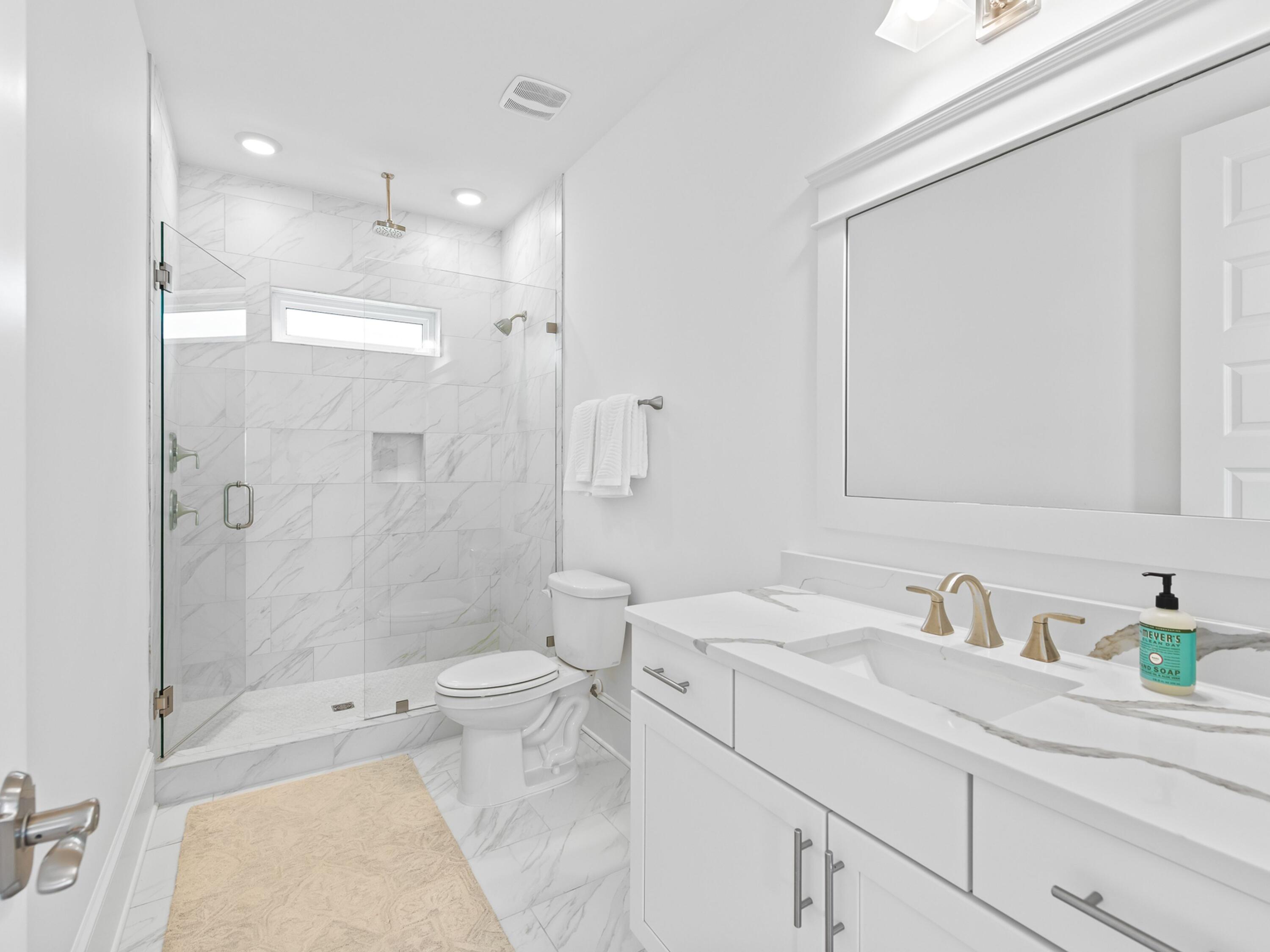 125 Seaboard Lane Santa Rosa Beach, FL 32459 - Photo 42 of 49 a bathroom with a sink a toilet and shower