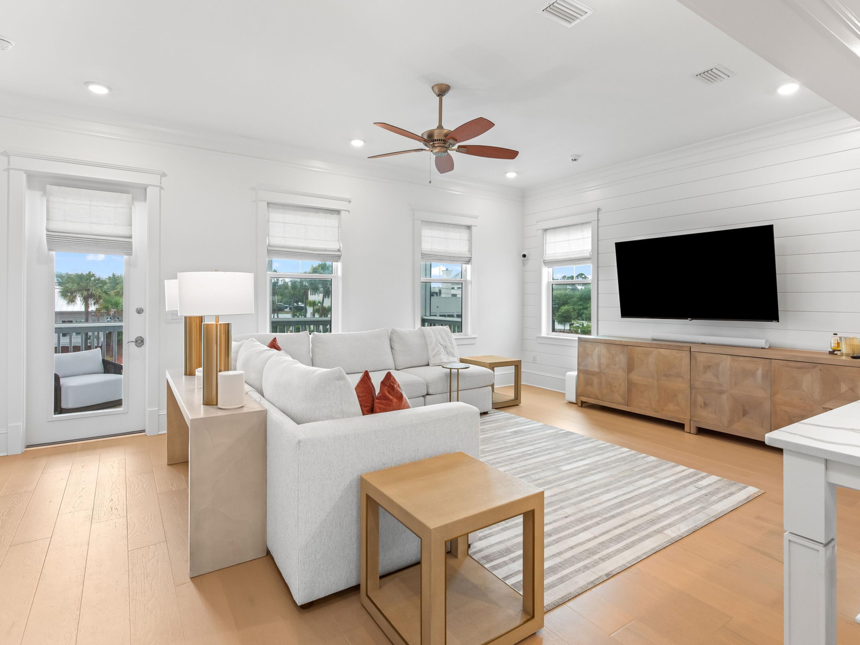 125 Seaboard Lane Santa Rosa Beach, FL 32459 - Photo 5 of 49 a living room with furniture and a flat screen tv