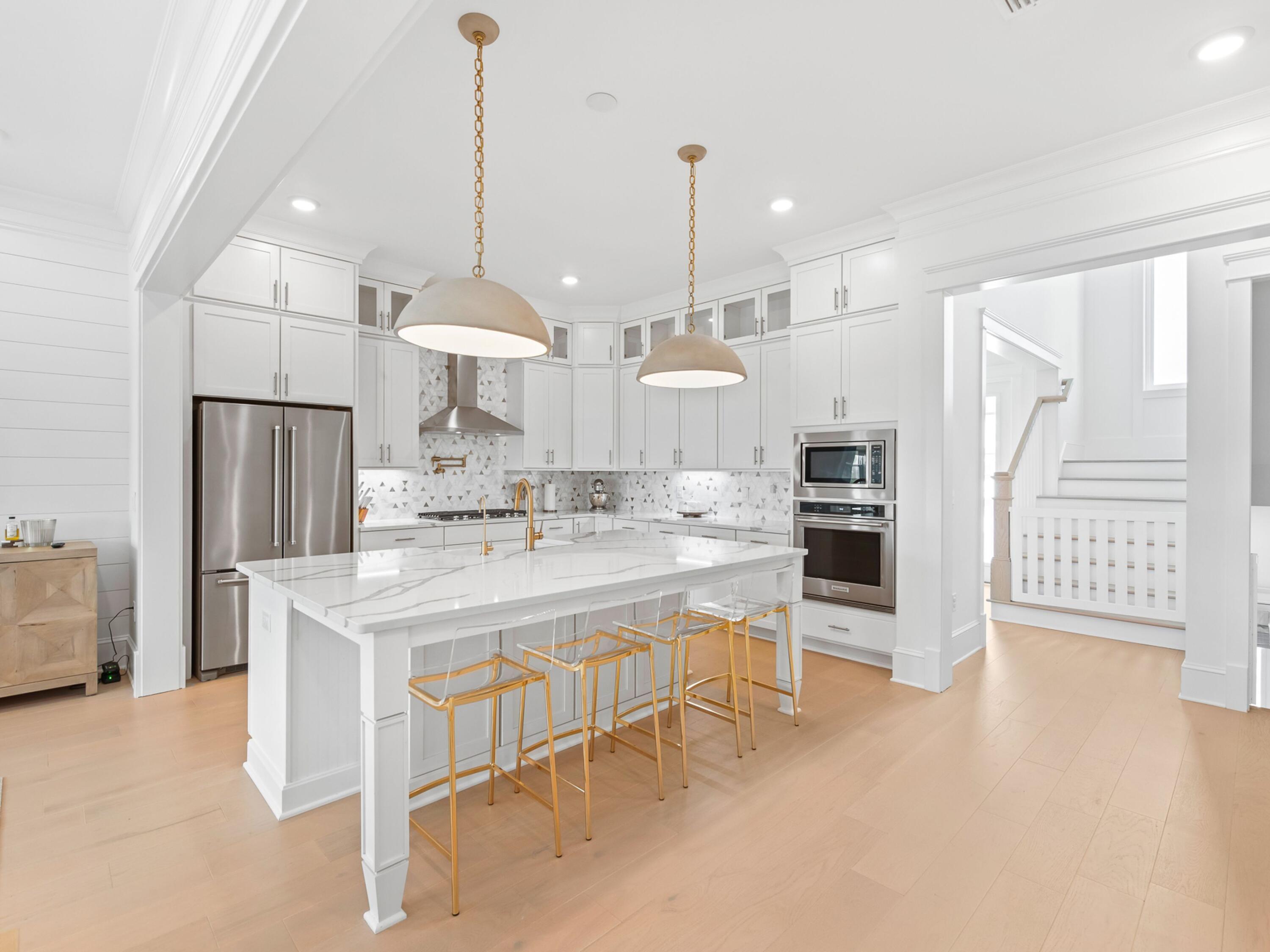 125 Seaboard Lane Santa Rosa Beach, FL 32459 - Photo 7 of 49 a large kitchen with a table and chairs