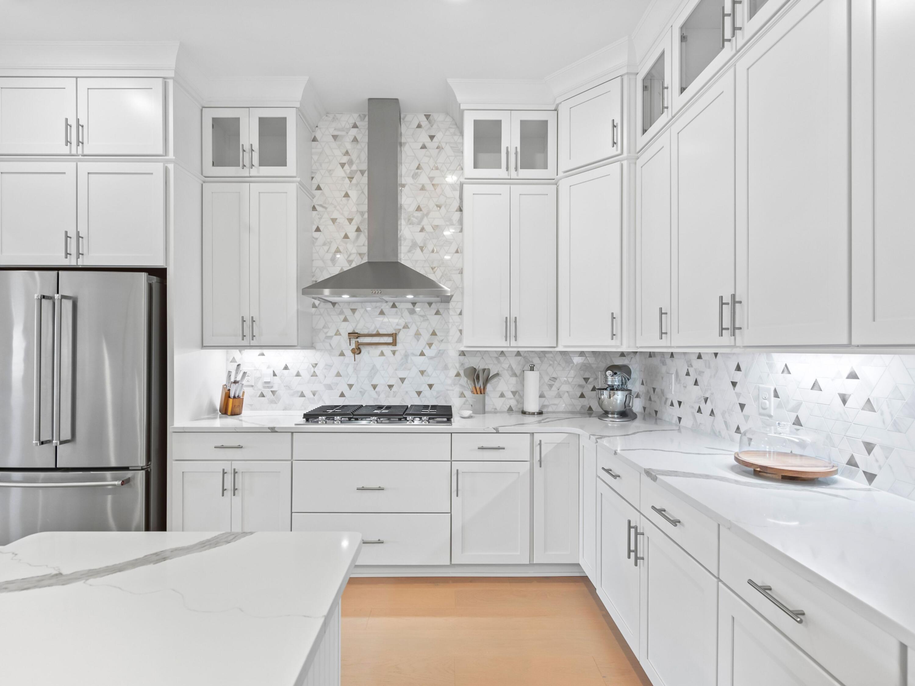 125 Seaboard Lane Santa Rosa Beach, FL 32459 - Photo 8 of 49 a kitchen with stainless steel appliances white cabinets and sink