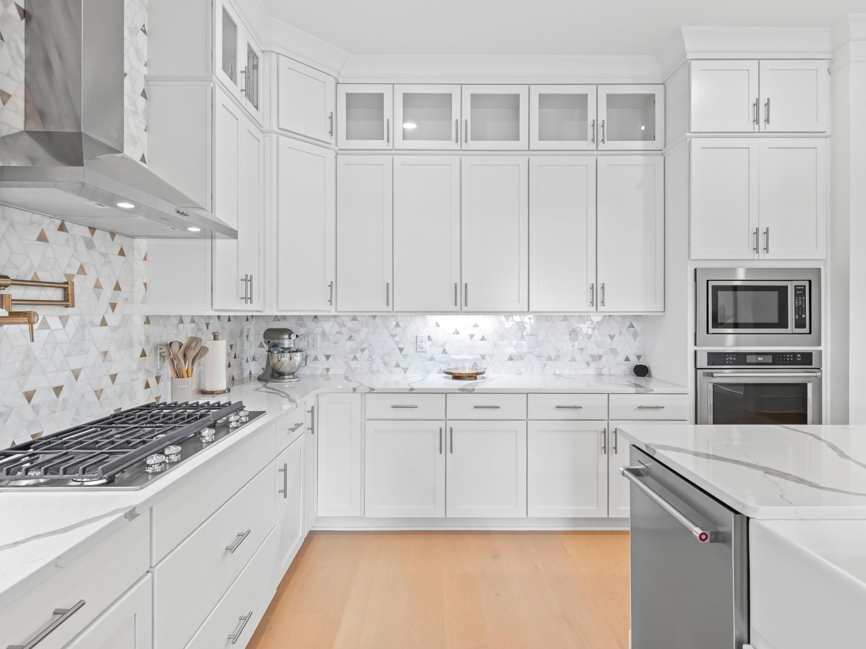 125 Seaboard Lane Santa Rosa Beach, FL 32459 - Photo 9 of 49 a kitchen with granite countertop white cabinets and stainless steel appliances